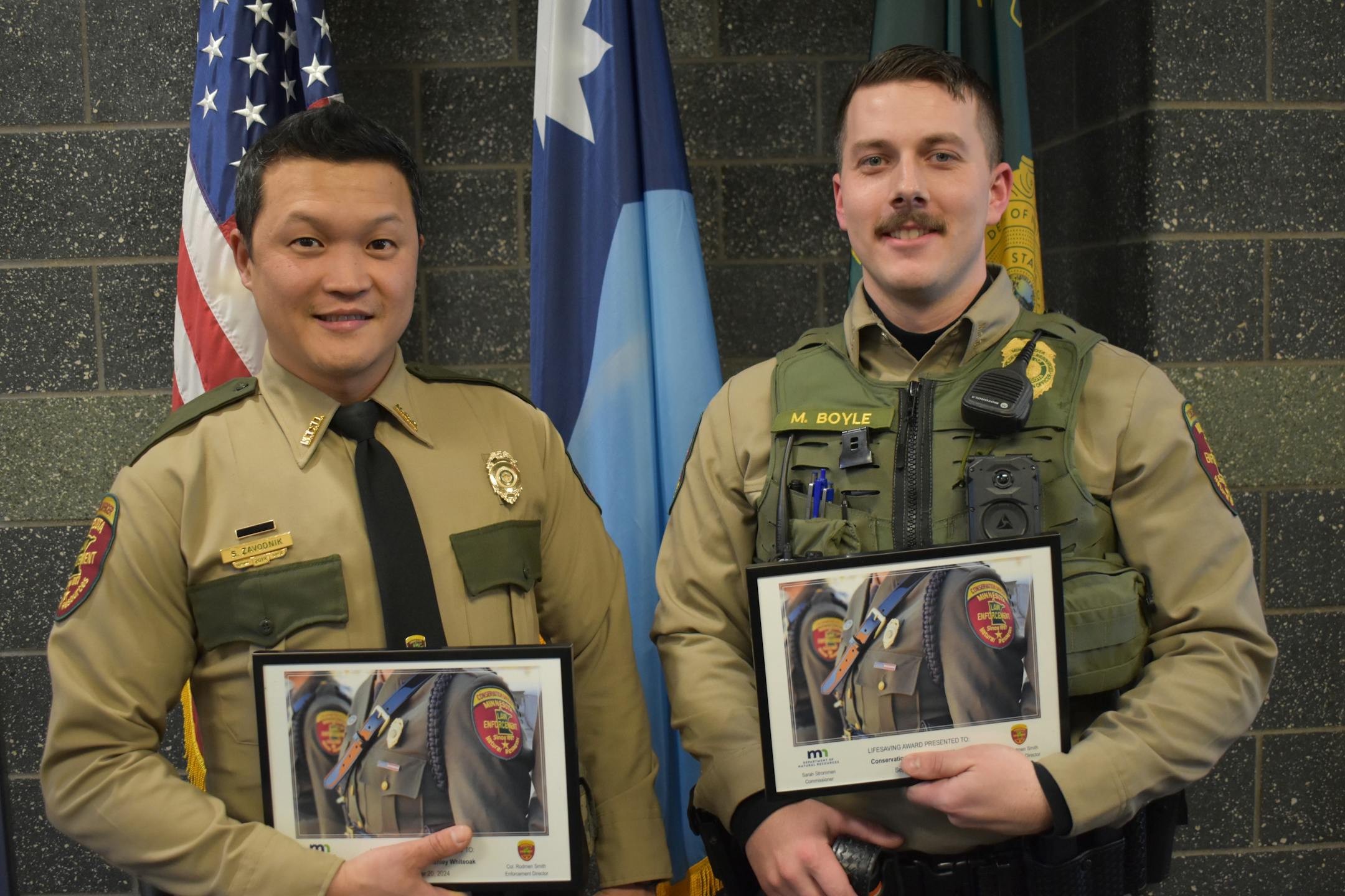DNR conservation officers COs Matt Boyle and Shane Zavodnik trekked through rugged terrain to rescue a man pinned beneath his crashed airplane.