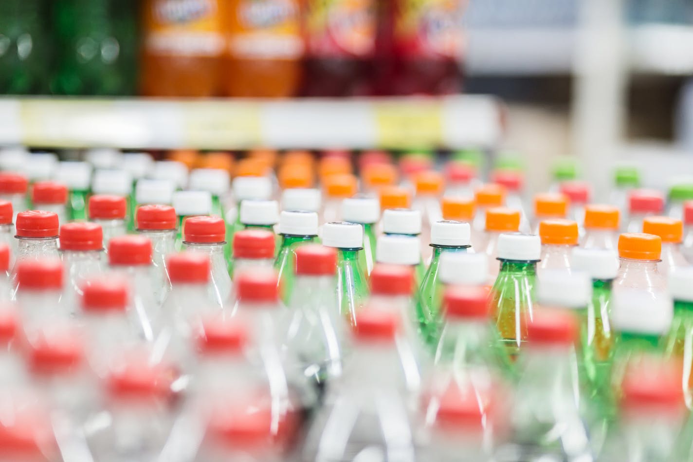 Rows of plastic bottles cap with bllur background