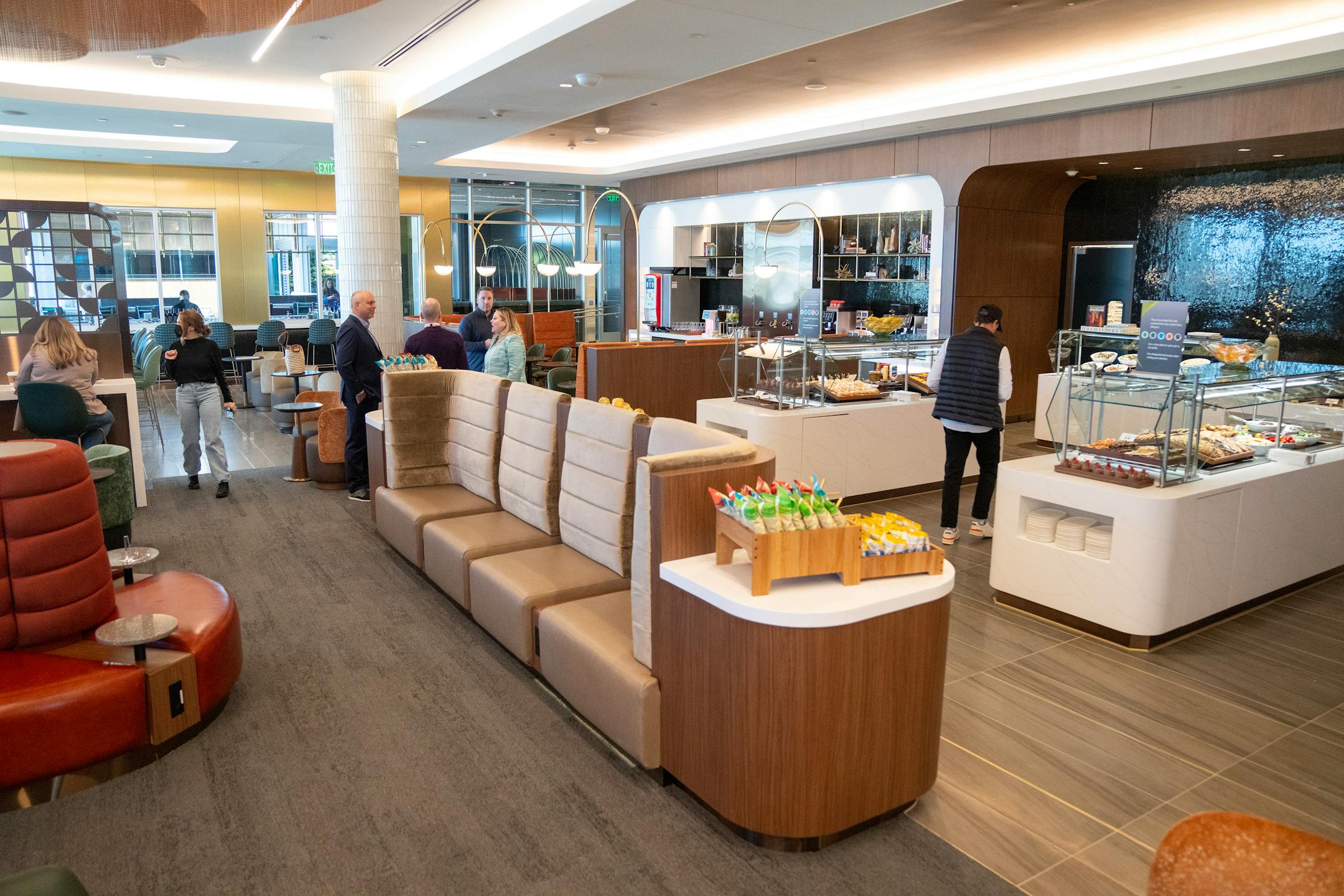 The new Delta Sky Club features a full buffet, Coke freestyle machine, Starbucks coffee dispensers and other high end drinks.