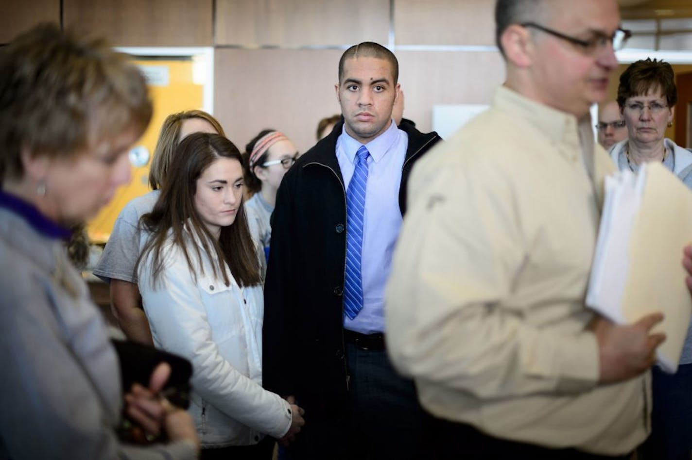 Issac Kolstad and his wife Molly listened as his father Blaine, right spoke to the media. On the left is Solstad's mother Teresa. Earlier Philip Nelson left the Blue Earth courthouse by a side door as his attorney talked with the media. He received 100 hours of community service and no jail time in the beating of .