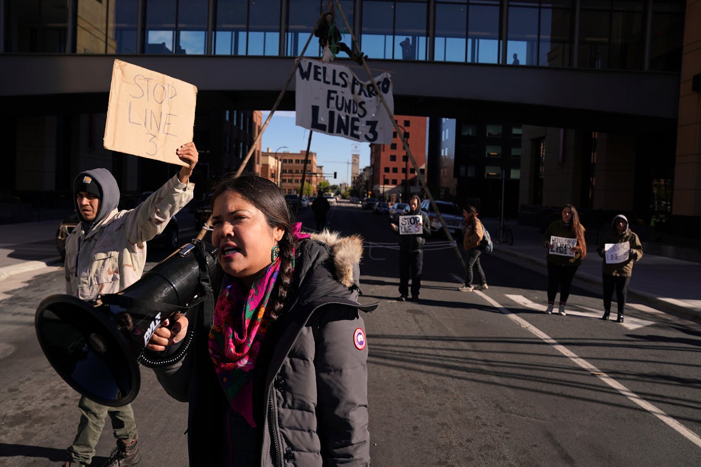 Tara Houska, pictured here protesting the Enbridge Line 3 pipeline in 2018, said a TSA agent at MSP Airport pulled on her braids and "whipped them like reins."