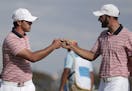 Brooks Koepka, left, and Dustin Johnson, shown during the 2017 Presidents Cup, will play in the 3M Open at Blaine next month.