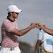 Brooks Koepka, left, and Dustin Johnson, shown during the 2017 Presidents Cup, will play in the 3M Open at Blaine next month.