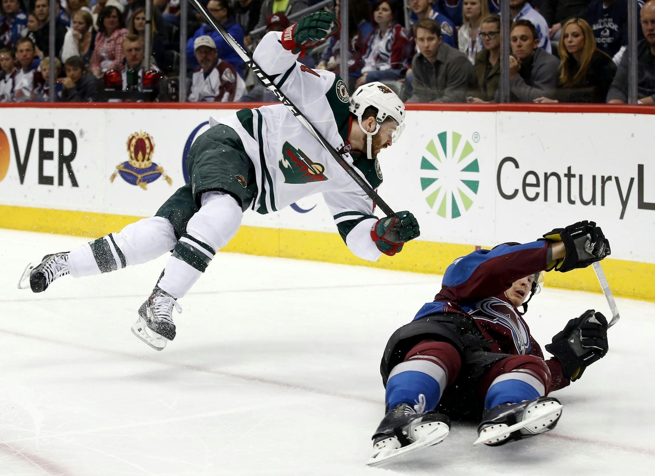 Justin Fontaine (14) and Nick Holden (2) collided in the third period.