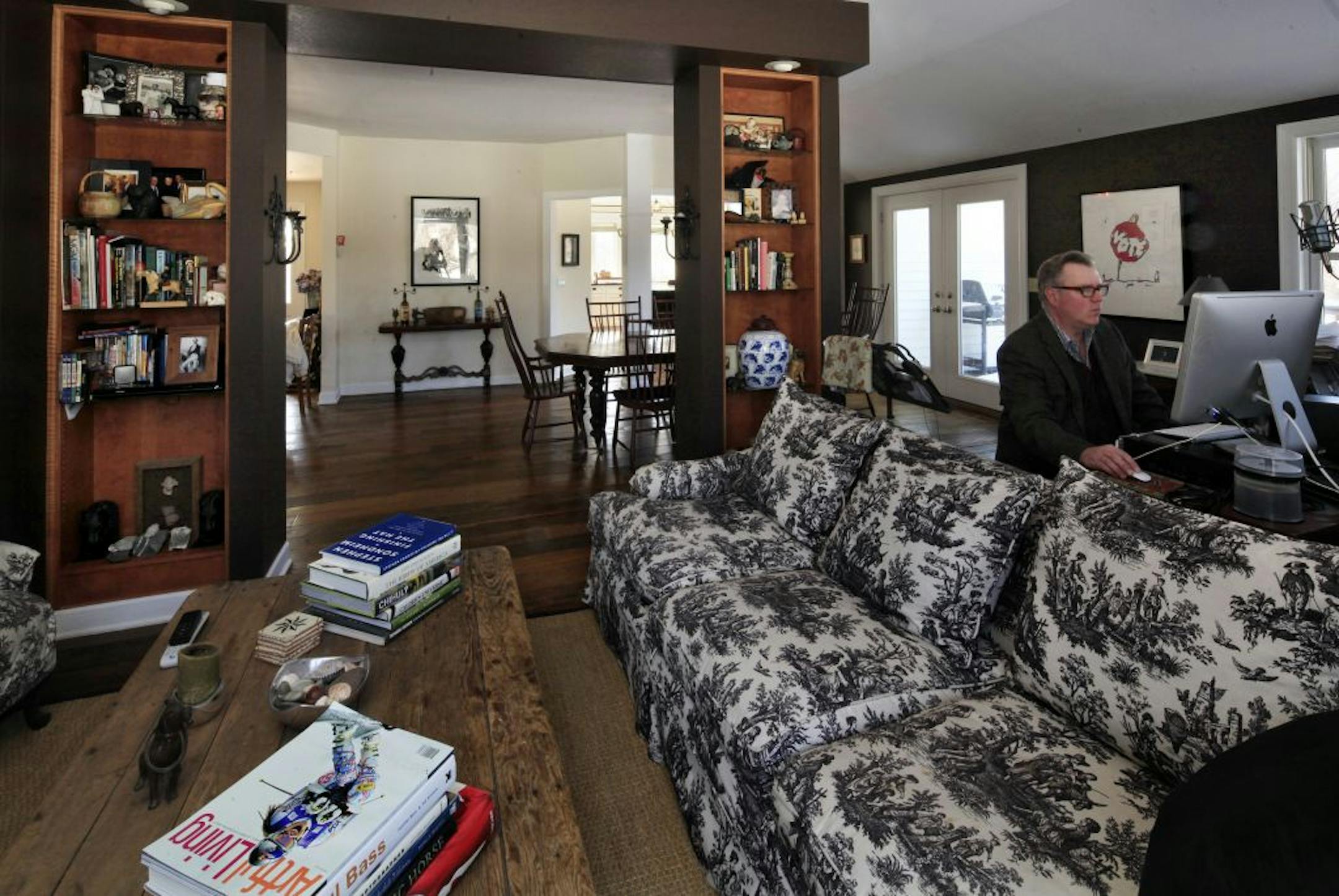 Musician Chan Poling works in the living room next to the grand piano in his home in Prior Lake, MN on February 11, 2013.