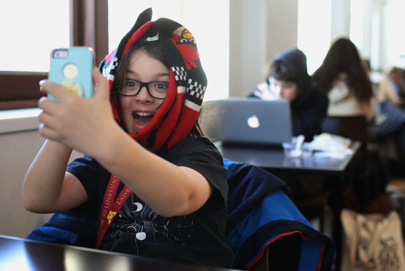 Elliott Tanner, 11, from St. Louis Park, a junior at the University of Minnesota, takes a selfie in the Surdyk's Café in Northrup auditorium, where he was having lunch with him mom, Michelle, on Dec. 11.