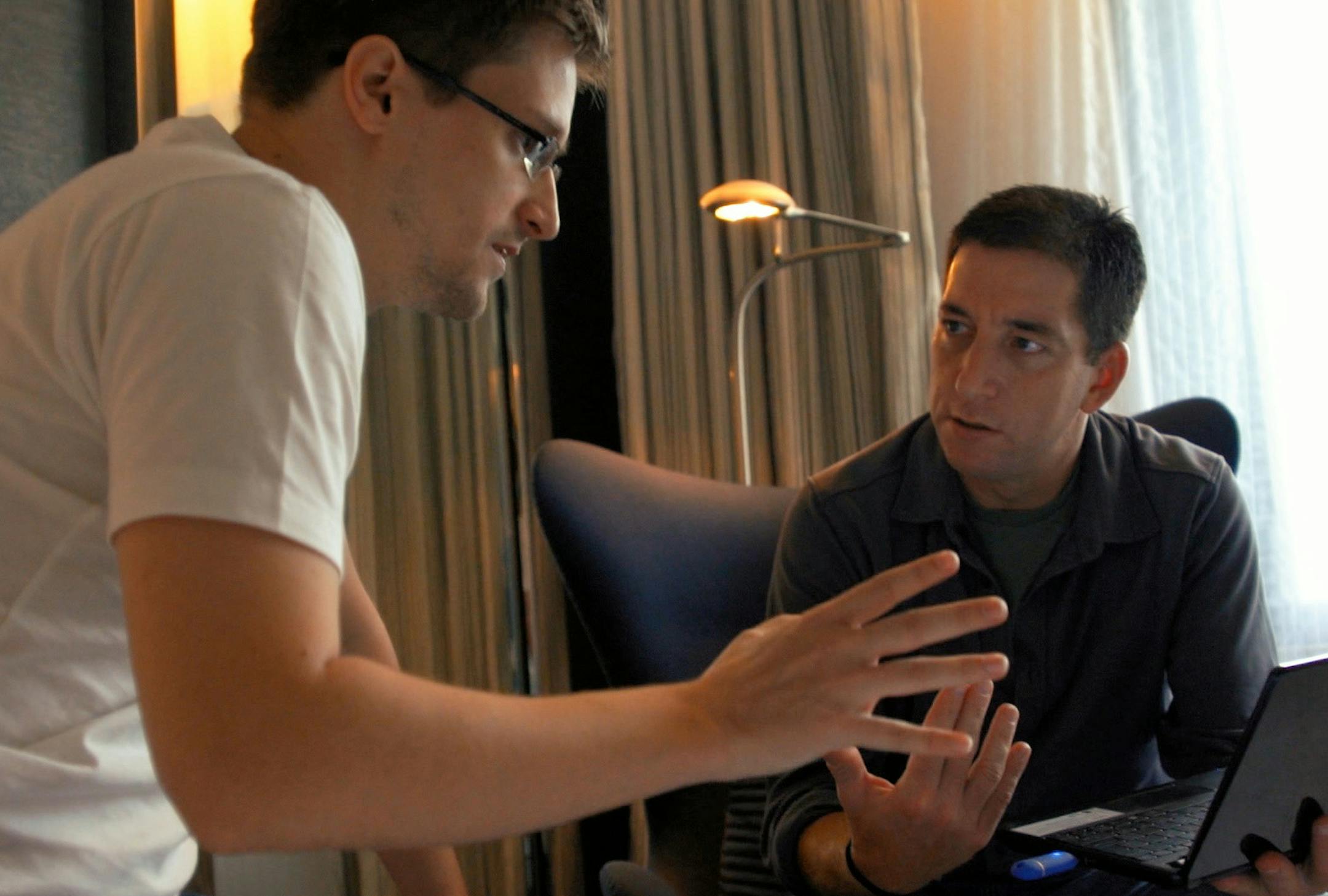 In this image released by Radius TWC, Edward Snowden, left, appears with Glenn Greenwald in a scene from "Citizenfour," a documentary that intimately captures Snowden during his leak of NSA documents. (AP Photo/Radius TWC) ORG XMIT: MIN2014103114240758