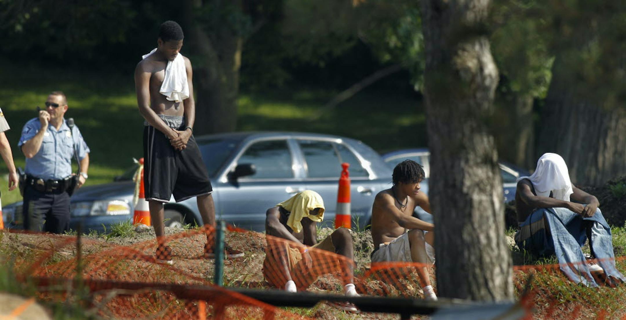 Friends stood by while authorities searched for the body of a 17-year-old who drowned Tuesday at Wirth Lake in Minneapolis.