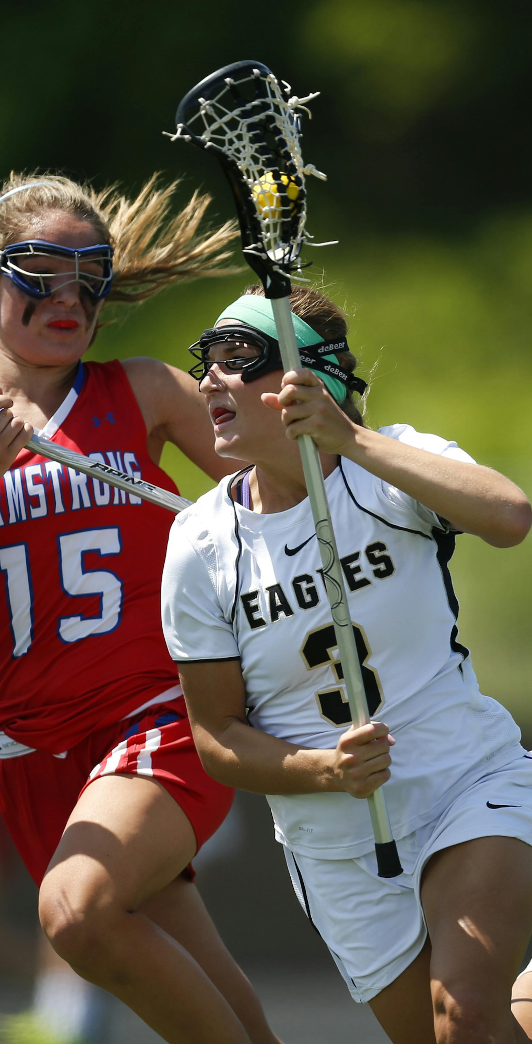 Apple Valley's Katie Larson moved the ball upfield in the second half while being defended by Robbinsdale's Kali Reinhardt in their game Tuesday afternoon at Chanhassen High School. ] JEFF WHEELER ‚Ä¢ jeff.wheeler@startribune.com The Apple Valley beat Robbinsdale 8-7 in their girl's state lacrosse quarterfinal games were held Tuesday afternoon, June 10, 2014 at Chanhassen High School