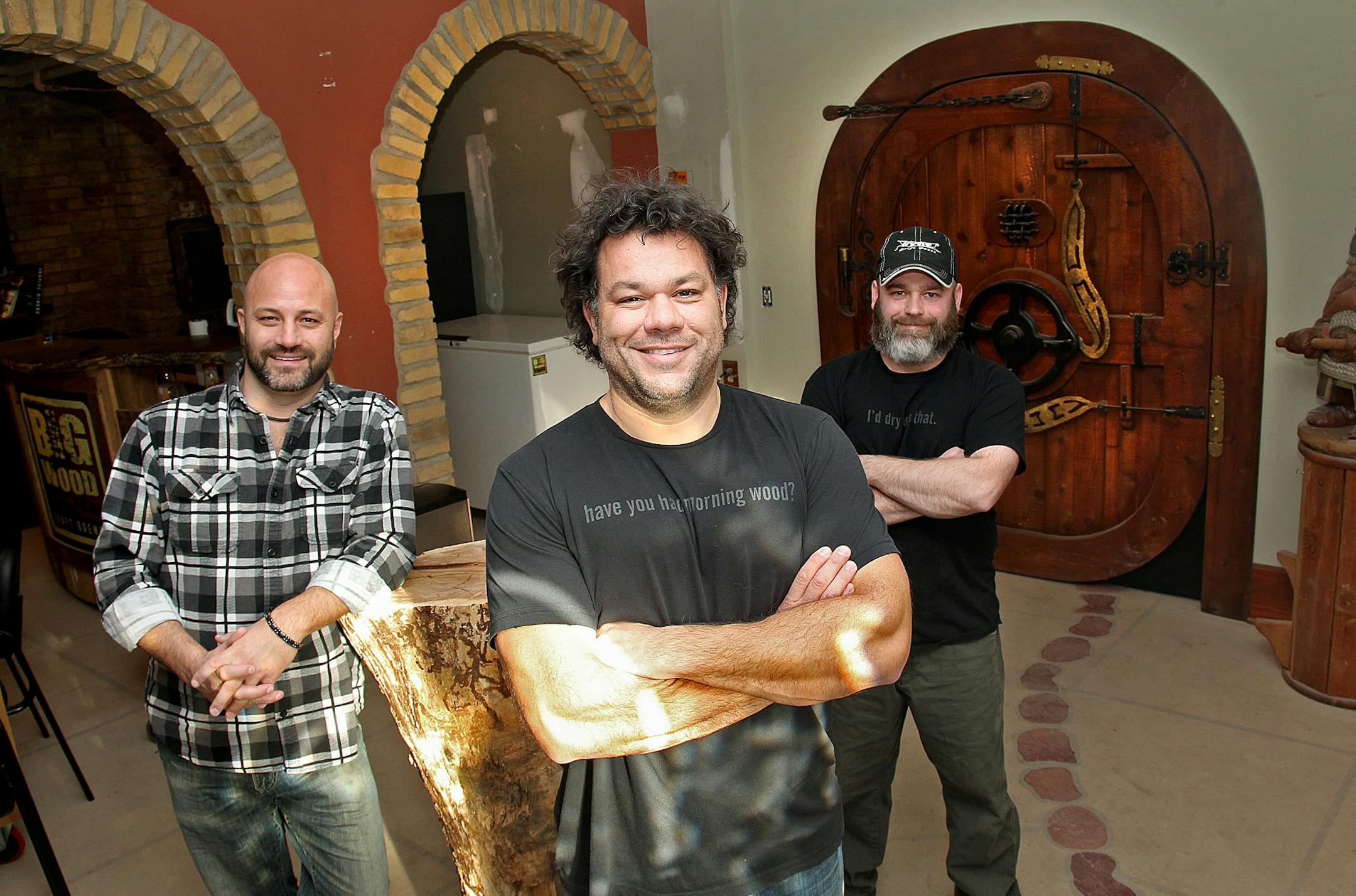 Steve Merila, center, and his business associates Jason Medvec, left, and Ty McBee, all of Big Wood Brewery will soon be expanding and revealing their latest beer from their new White Bear Lake location, Monday, December 10, 2012. (ELIZABETH FLORES/STAR TRIBUNE) ELIZABETH FLORES • eflores@startribune.com