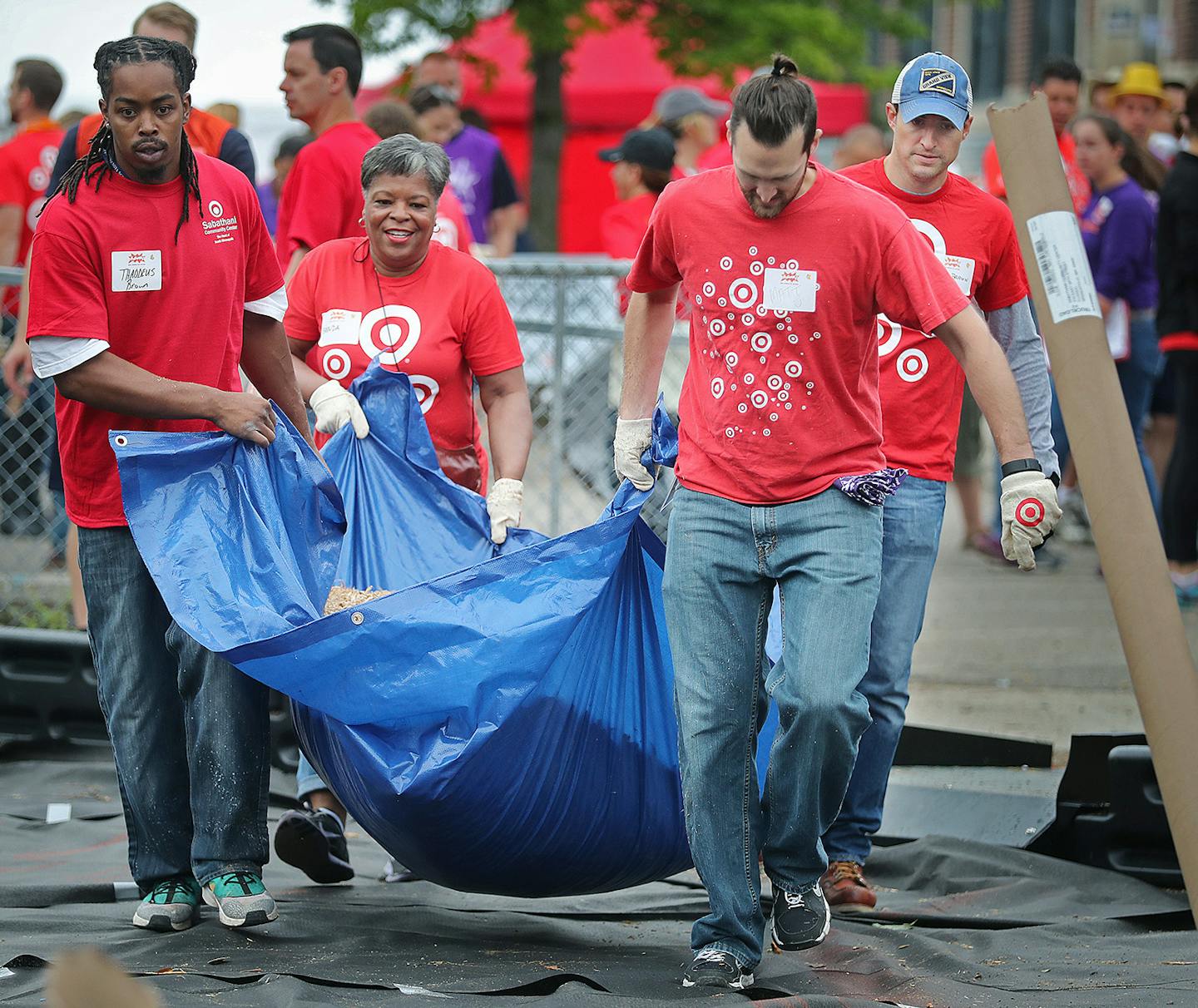 Thaddeus Brown, from left, Matt Arcaro, Brenda Banks and Ryan Brown of Target joined many other Target employees to partner up with Ka-Boom to build a playground at the Sabathani Community Center, Friday, September 16, 2016 in Minneapolis, MN. ] (ELIZABETH FLORES/STAR TRIBUNE) ELIZABETH FLORES &#x2022; eflores@startribune.com