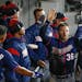 Minnesota Twins designated hitter Robbie Grossman, center, celebrates with teammates after scoring during the sixth inning of a baseball game against 