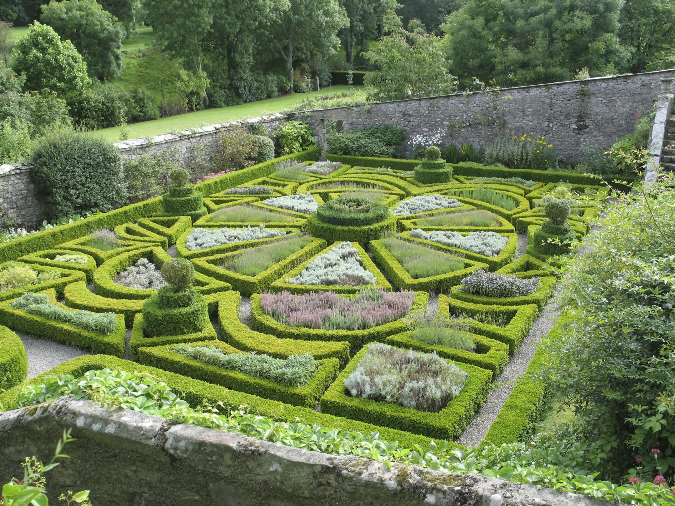 Among the gardens at Bodysgallen Hall in Wales is a 17th-century parterre. Combining art with botany, its carefully trimmed box hedges enclose scented herbs, all linked by narrow walkways creating a geometric pattern.