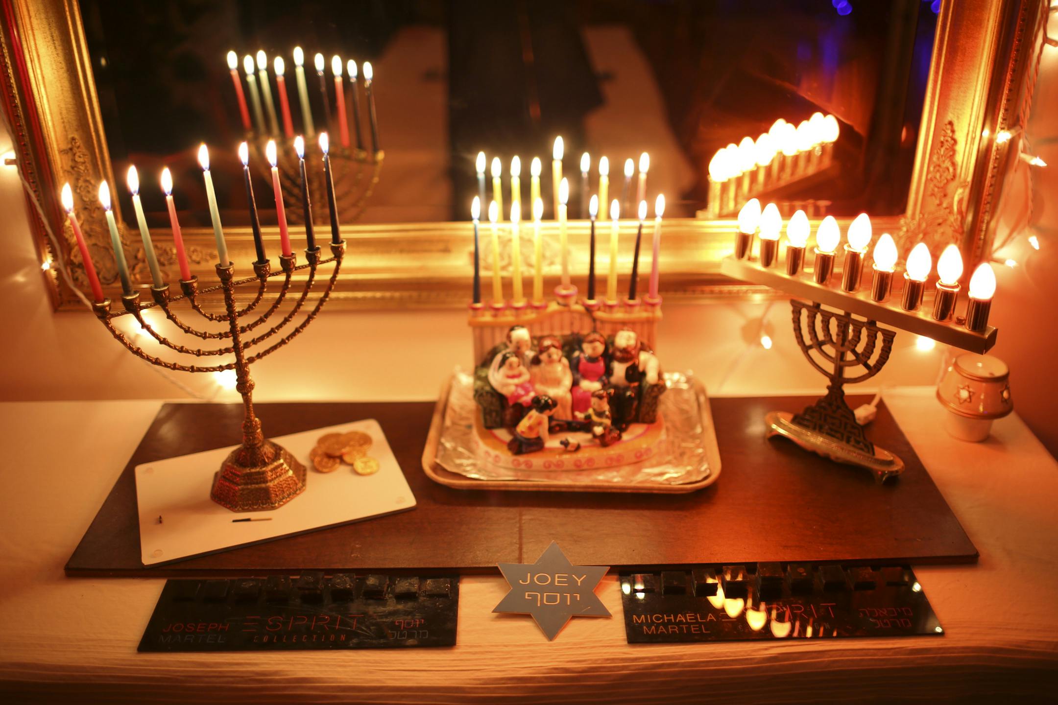 The menorahs made for Joseph and Michaela Martel when they were small children, foreground, by a family friend who was killed in the Accent Signage shootings last year. They are in the Minneapolis home of their father, Rod Martel and his wife Colleen Anderson Tuesday night, December 17, 2013. ] JEFF WHEELER ‚Ä¢ jeff.wheeler@startribune.com