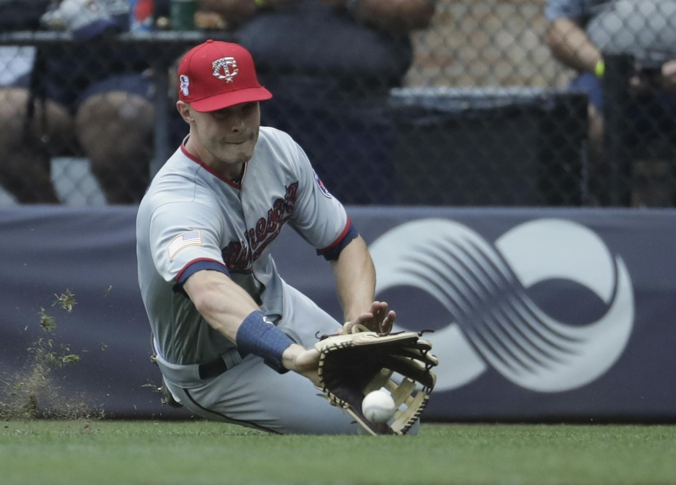 Minnesota Twins' Max Kepler can't catch a double hit by Milwaukee Brewers' Brad Miller during the third inning of a baseball game Tuesday, July 3, 2018, in Milwaukee.