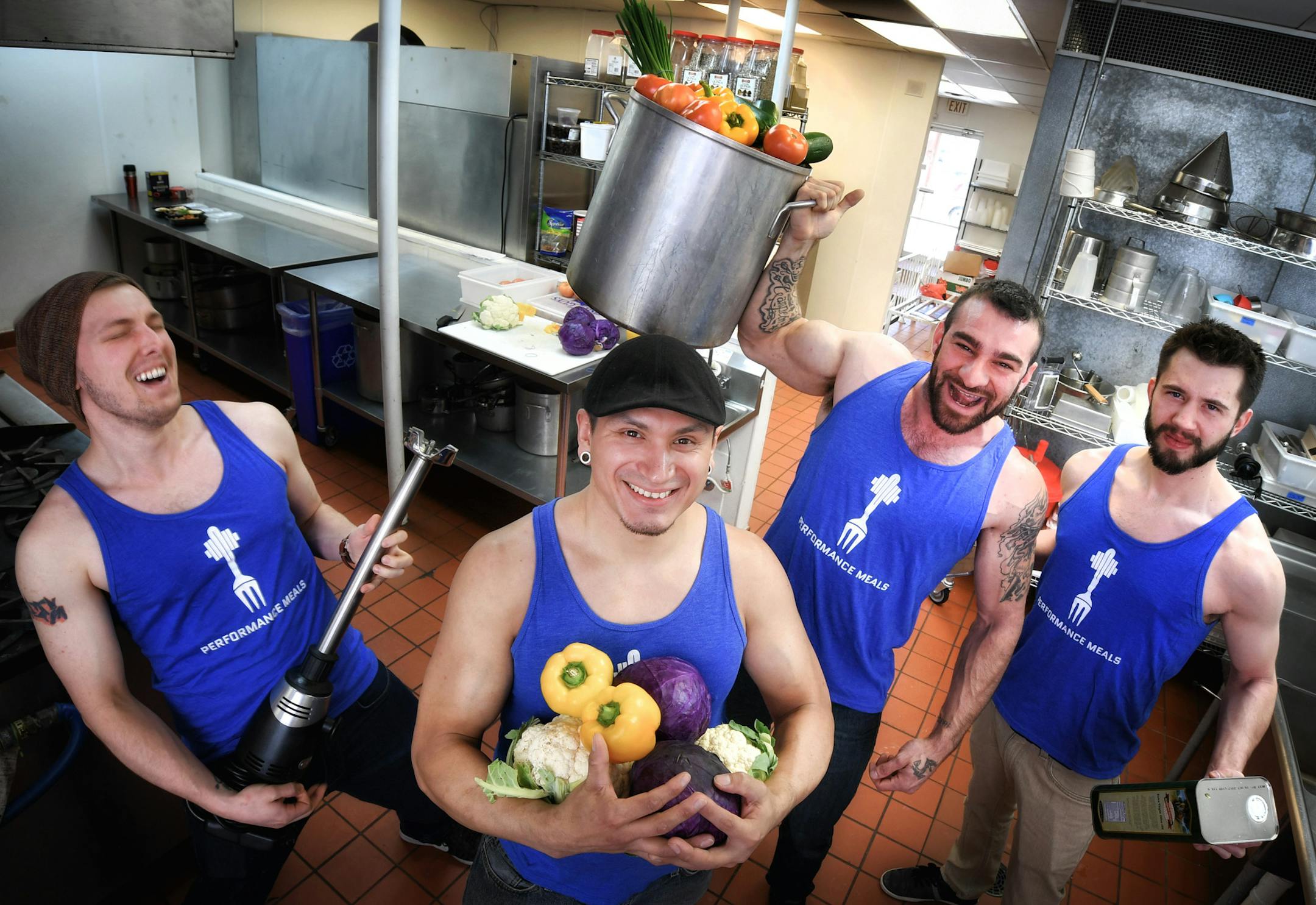 Performance Meals staffers Cameron Anderson, Eddie LoneEagle, owner Adrian De Los Rios and Kyle Storley, in their Robbinsdale kitchen.