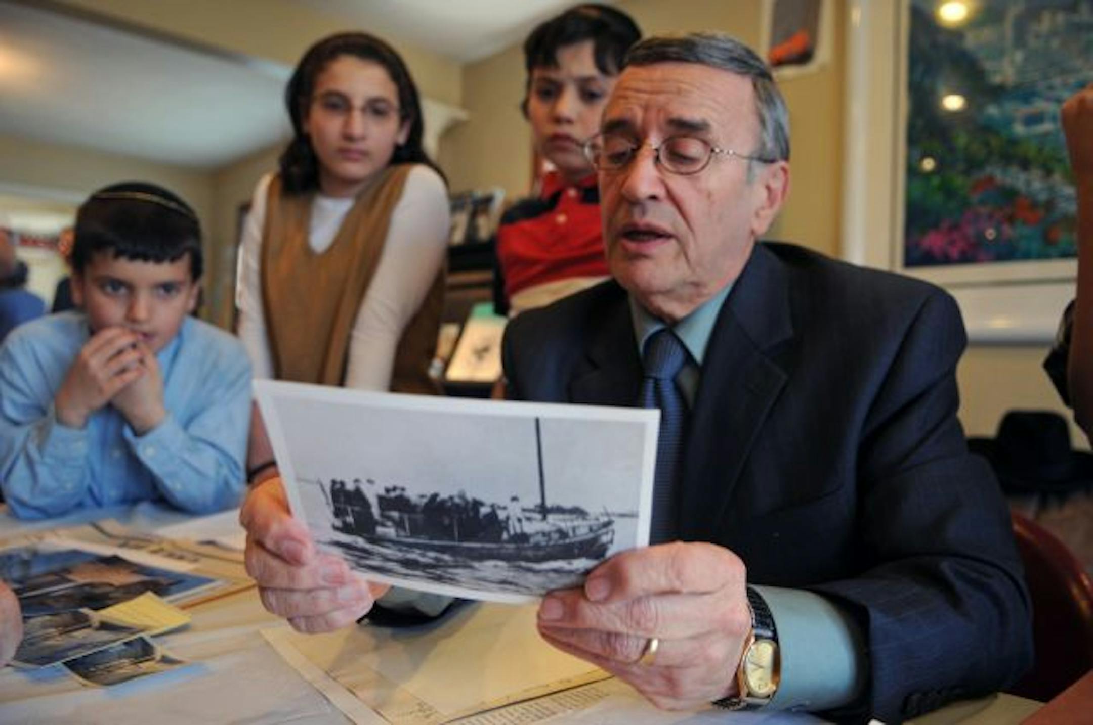 Gustav Goldberger showed his grandchildren a photo from the National Holocaust Museum. He was 9 when Danish fishermen smuggled him to Sweden.