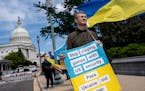 FILE - Activists supporting Ukraine, demonstrate outside the Capitol in Washington, April 20, 2024. The Senate is returning to Washington to vote on $