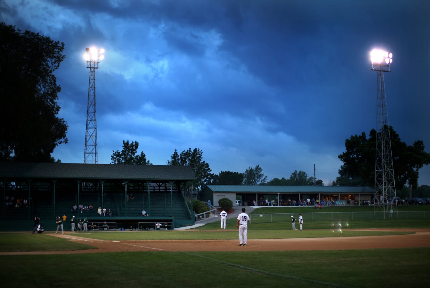 Lucas Mann&#x2019;s new book is about small-town baseball and all that it symbolizes. Here, a batter waited for the pitch at a ballpark built in the 1930s in Jordan, Minn.