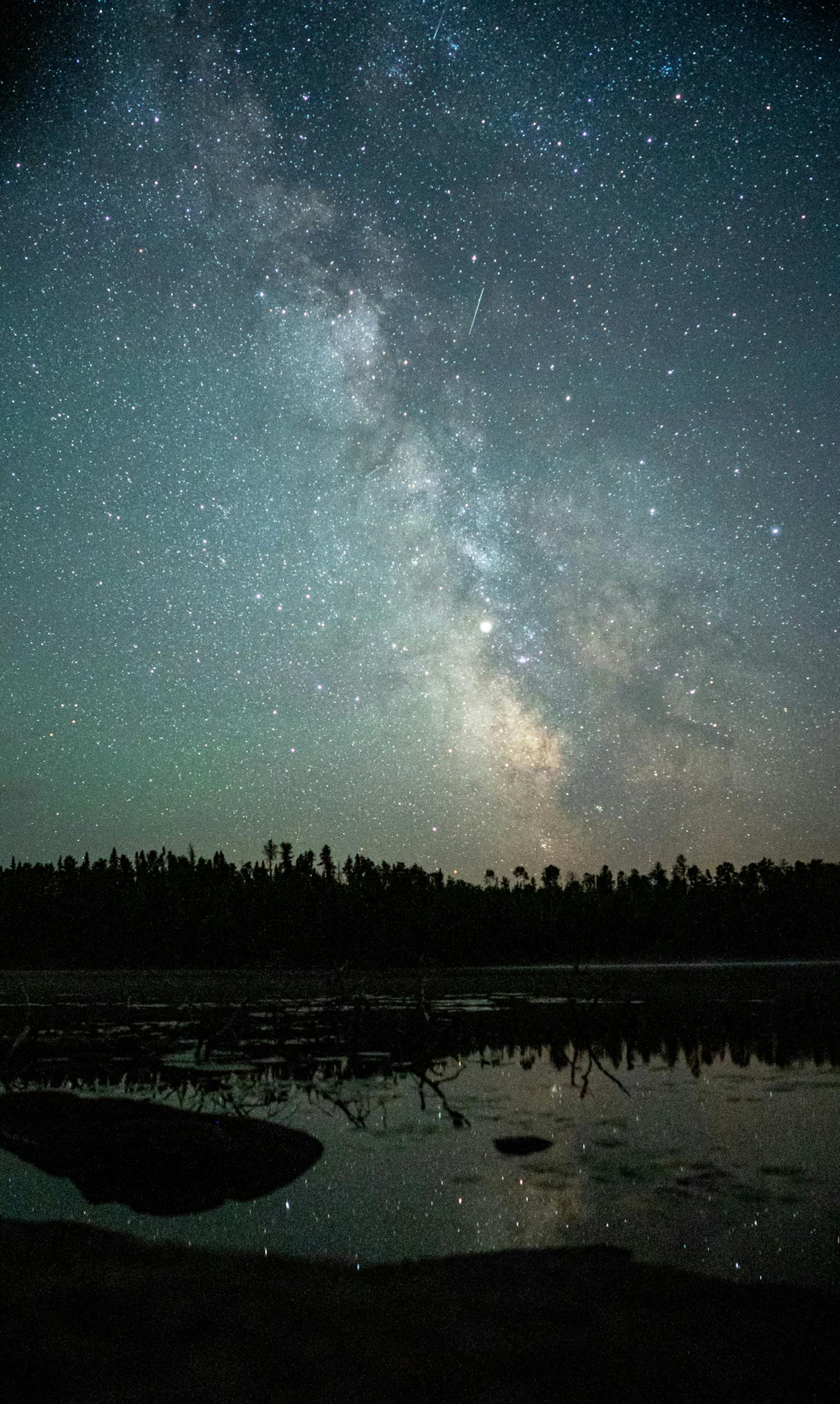 Planets Mars (left) and Saturn (center) shine brightly against the backdrop of the Milky Way above Fire Lake in the Boundary Waters Canoe Area.
] MARK VANCLEAVE &#xb4;
The darkness of the Boundary Waters Canoe Area provides for stellar views of the night sky. Photographed Thursday, Aug. 2, 2018.