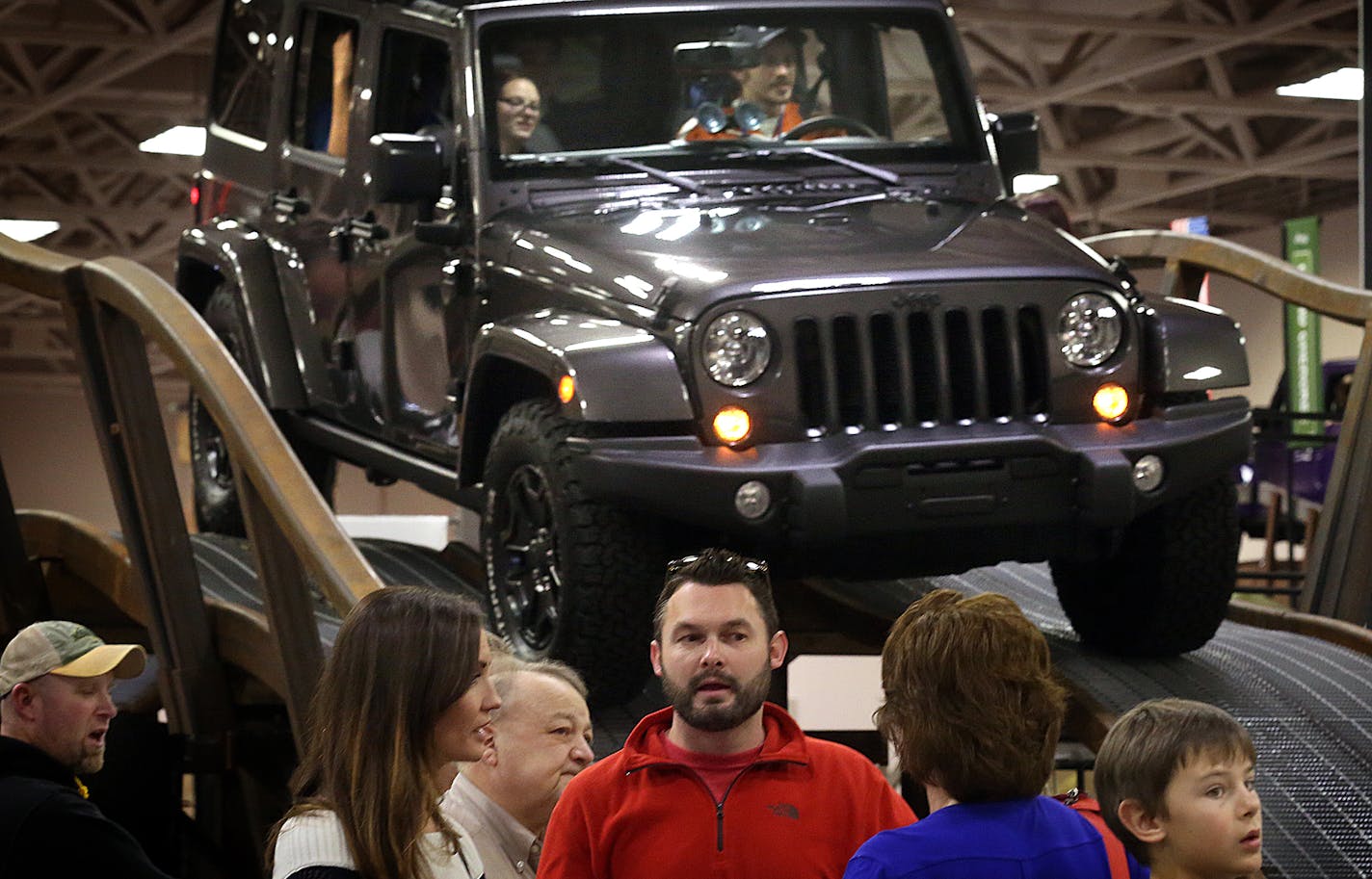 A Jeep loomed behind those waiting in line to take a turn driving one of several Jeep models through a modest obstacle course at Camp Jeep. ] JIM GEHRZ &#xef; james.gehrz@startribune.com /Minneapolis, MN / March 12, 2016 /10:00 AM - BACKGROUND INFORMATION: Please attend the media preview of the Twin Cities Auto Show for a story focusing on new tech features in cars. Preview is 10a-12p Saturday March 12. Reporter Katy Read is there. http://twincitiesautoshow.com/show-info/schedule