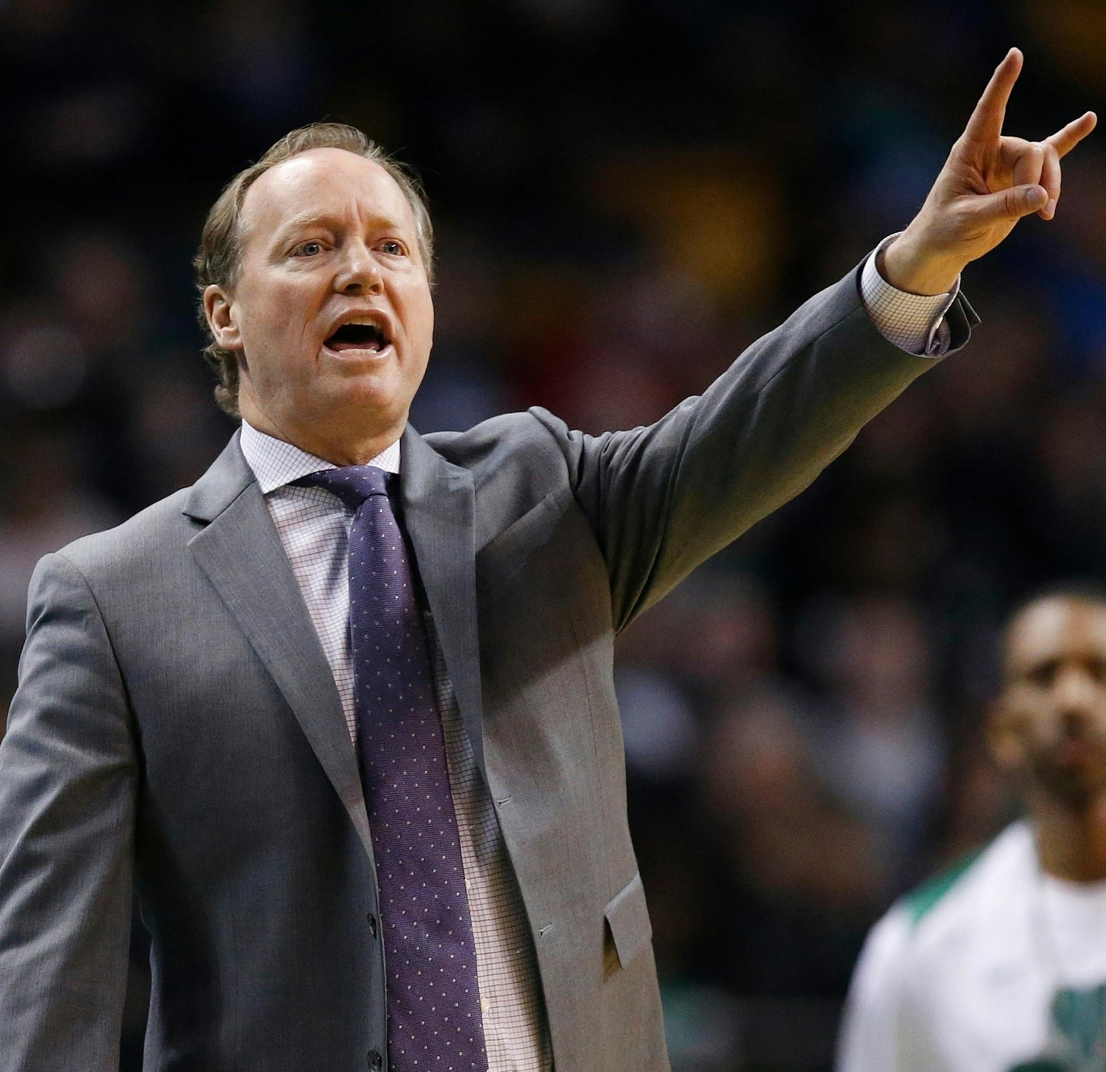 FILE - In this April 8, 2018, file photo, Atlanta Hawks coach Mike Budenholzer signals during the third quarter of the team's NBA basketball game against the Boston Celtics in Boston. A person familiar with the search tells The Associated Press that the Milwaukee Bucks have reached agreement with Budenholzer to become the team's next coach. The 2015 NBA Coach of the Year will replace Joe Prunty, the former assistant who went 21-16 in the regular season after replacing the fired Jason Kidd in lat