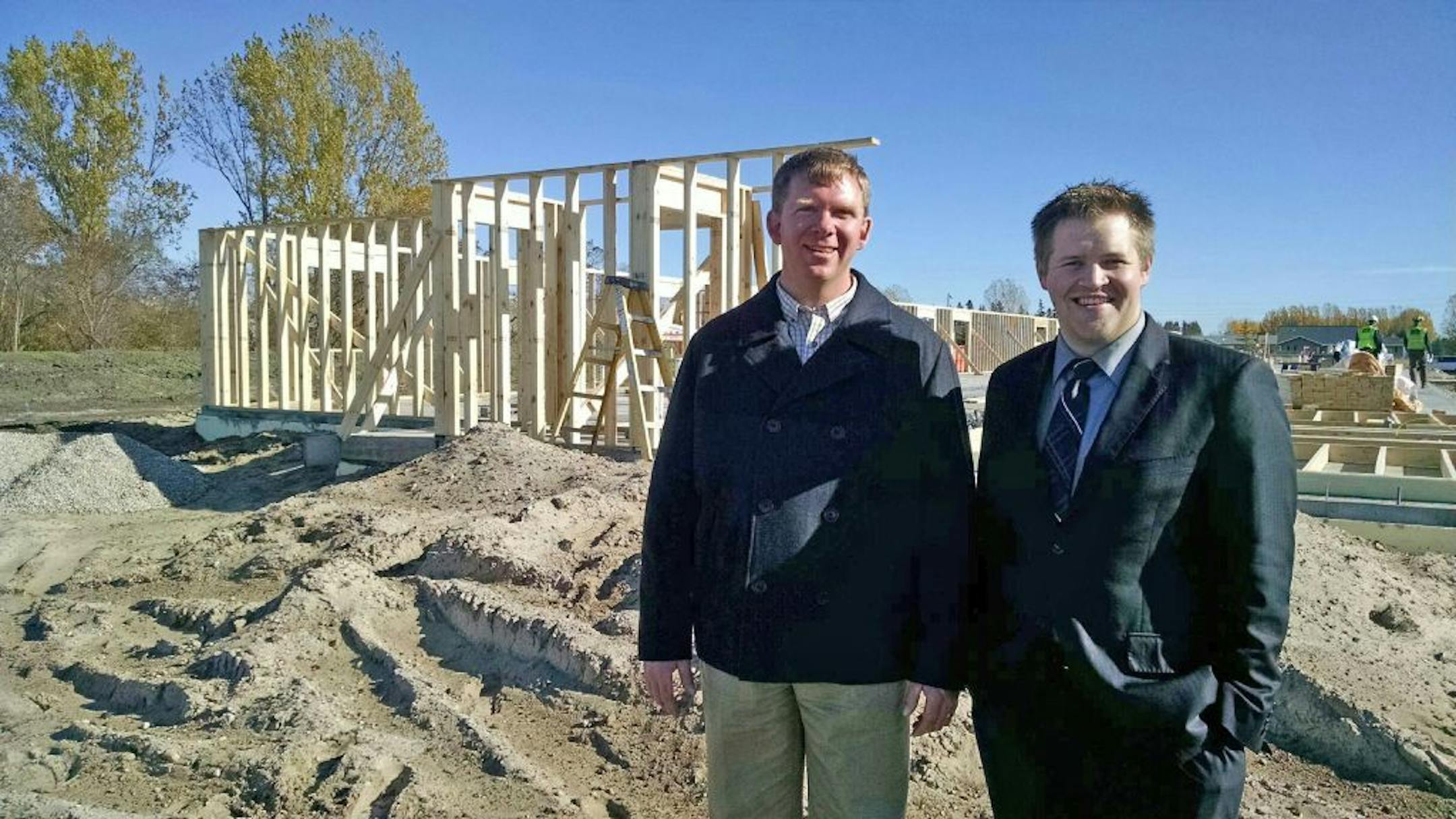 Darrin Smedsmo, left, and Nick Kvidt, developers of a 30-unit apartment building in Roseau, standing in front of the construction site on Oct. 23, 2014.