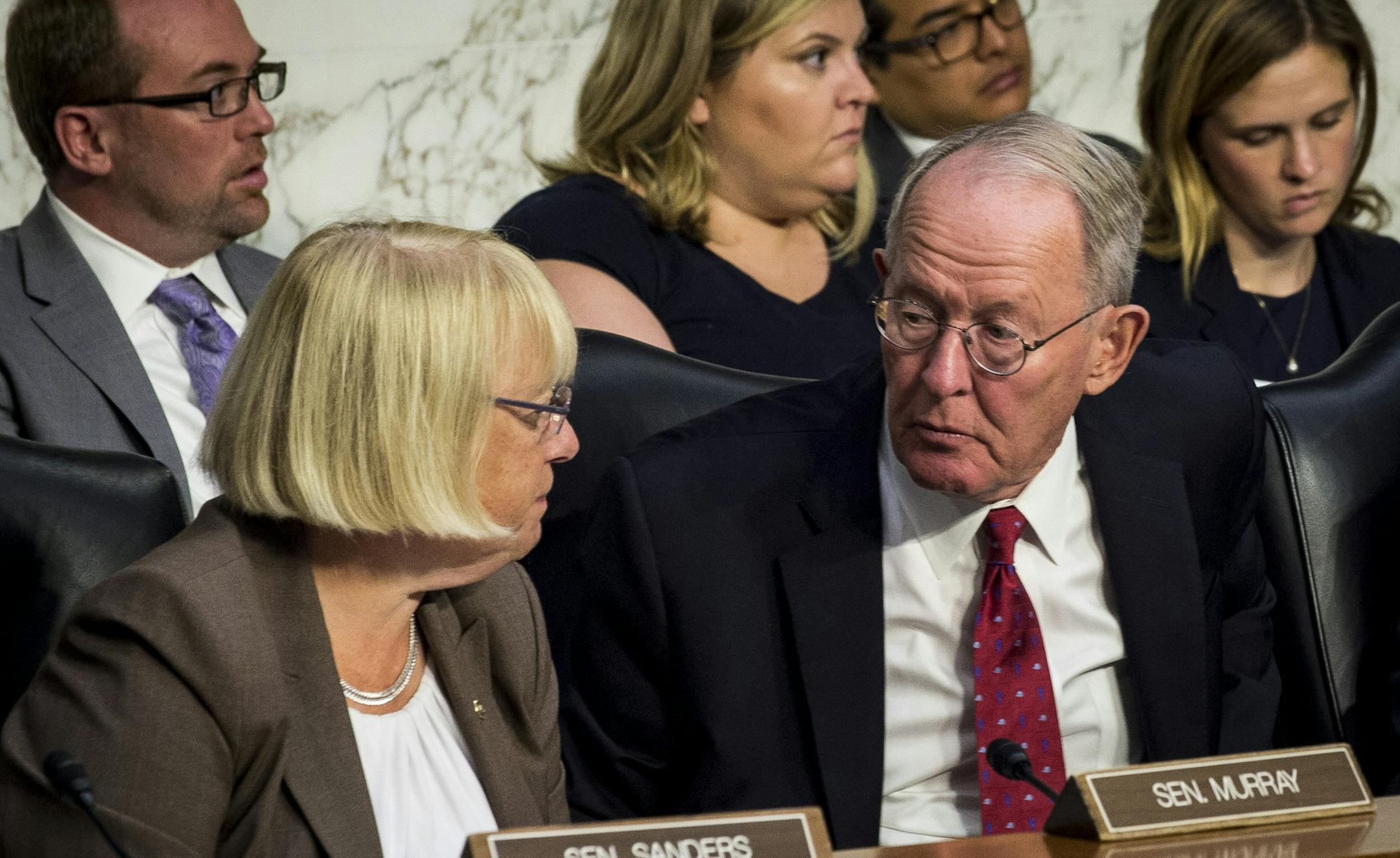 Sens. Lamar Alexander (R-Tenn.) and Patty Murray (D-Wash.) confer as state insurance commissioners appear before the Senate health committee about ways to stabilize the federal health law on Capitol Hill in Washington, Sept. 6, 2017. Alexander said Wednesday that he hoped the panel would reach a consensus by the end of next week on a small, bipartisan bill to stabilize health insurance markets and prevent prices from skyrocketing next year under the Affordable Care Act. (Pete Marovich/The New Yo