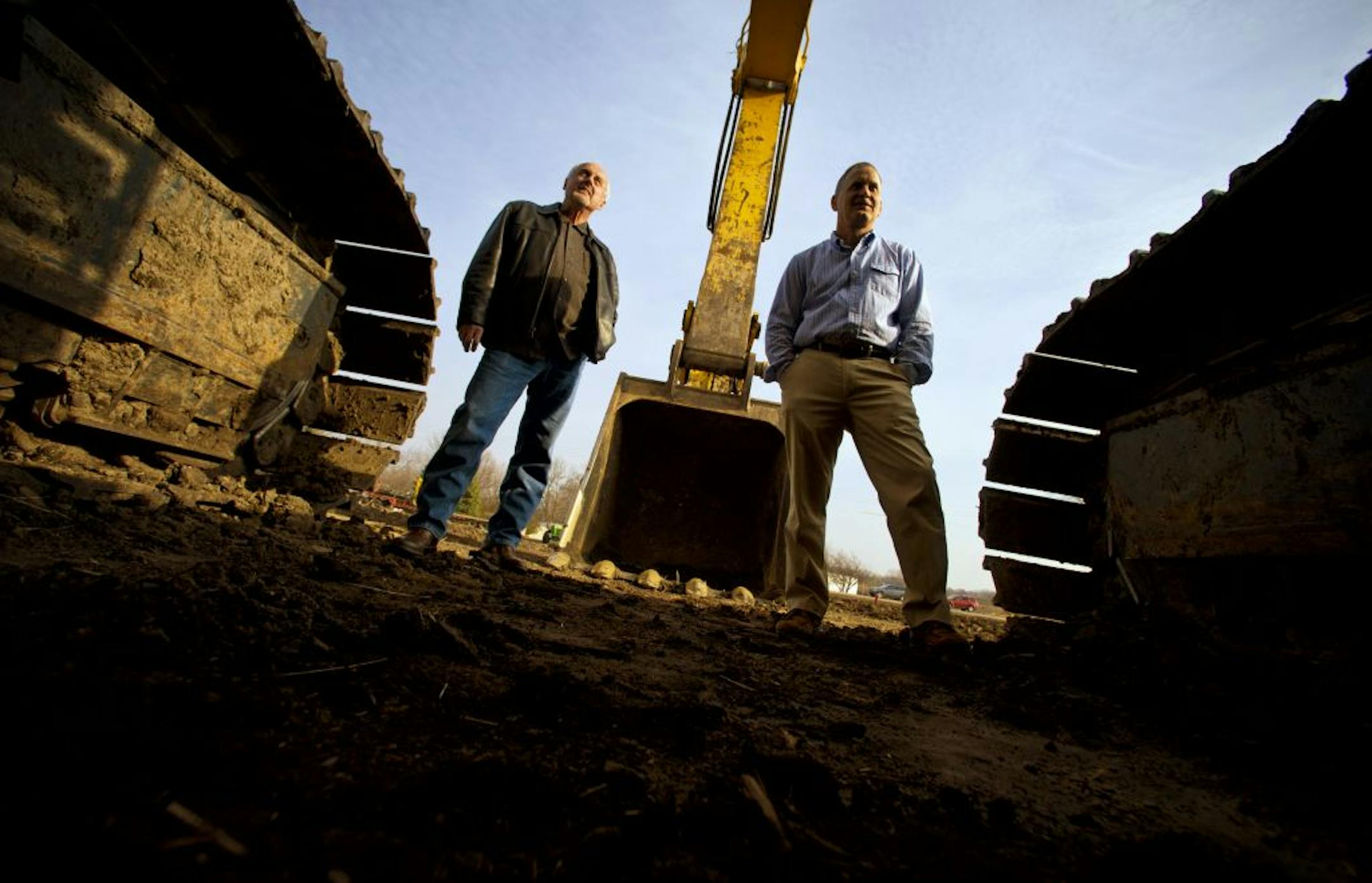 Daniel Donahue, left, Corcoran's city administrator, and Corcoran Mayor Ken Guenthner, right, were instrumental in bringing the rural city west of Minneapolis its first water and sewer lines.