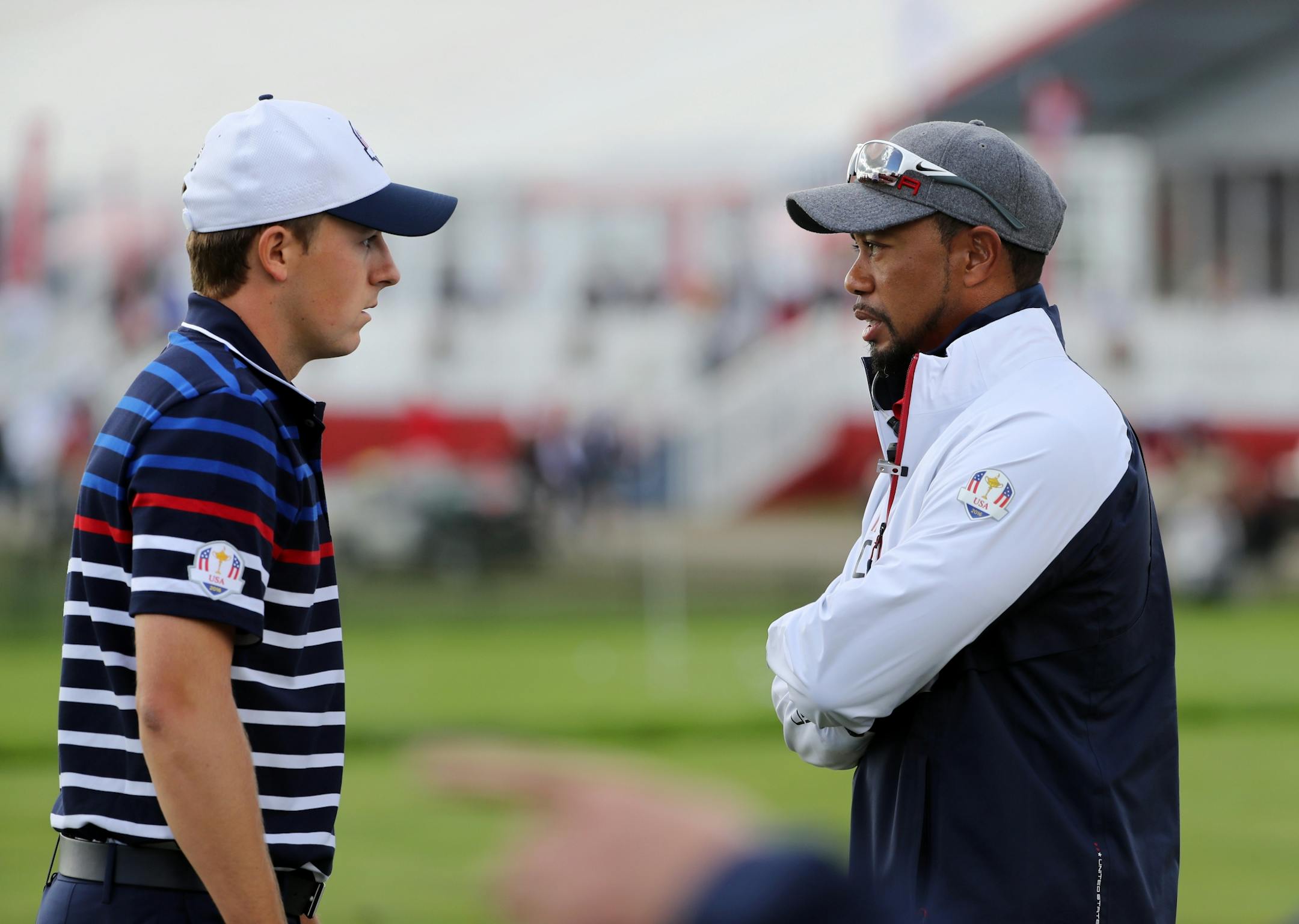 Team USA�s Jordan Spieth (left) chats with Vice Captain Tiger Woods on the practice tee Thursday morning.