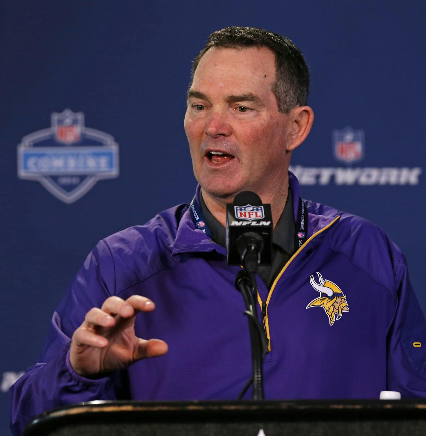 Minnesota Vikings head coach Mike Zimmer answers a question during a news conference at the NFL football scouting combine in Indianapolis, Friday, Feb. 21, 2014. (AP Photo/Michael Conroy)