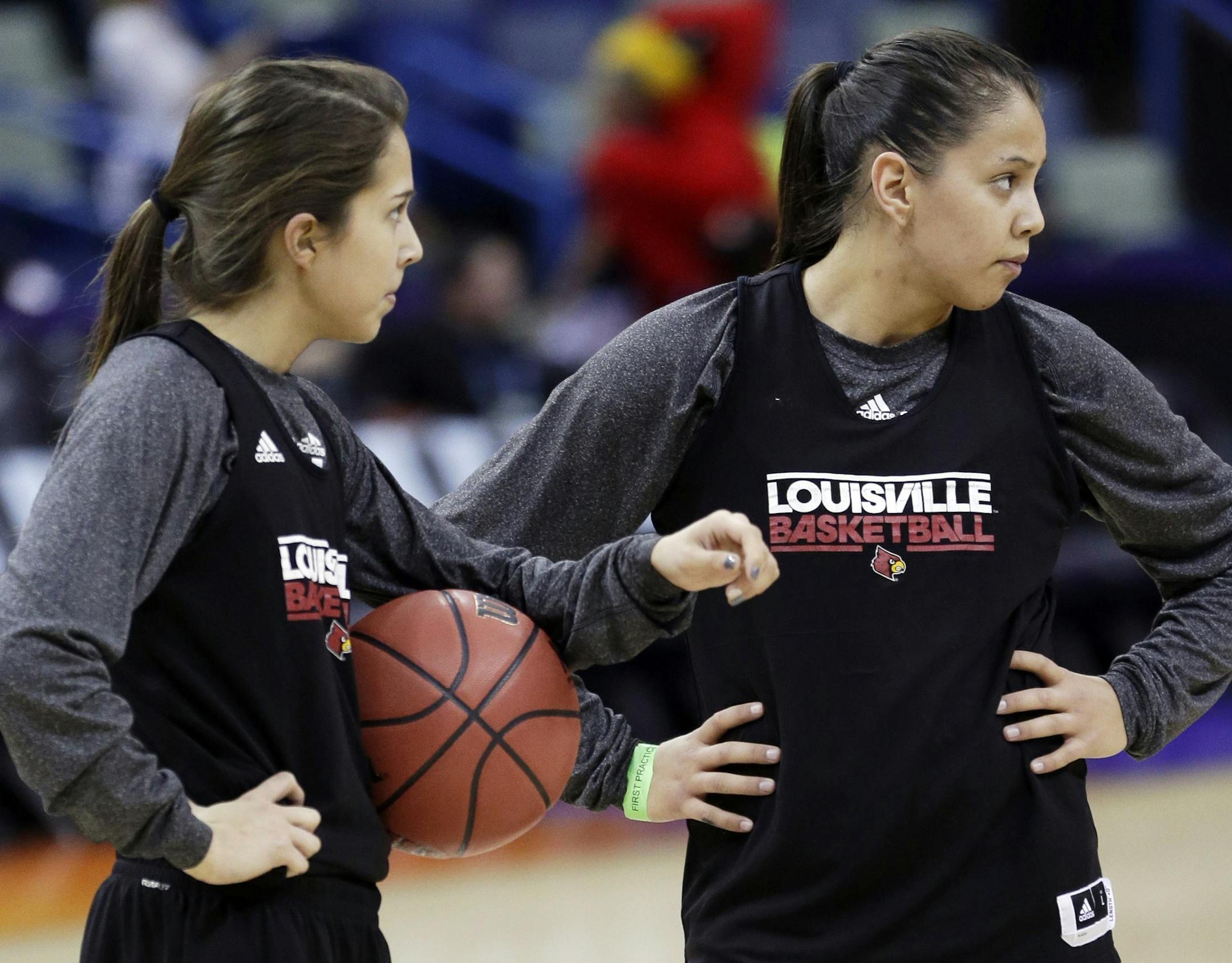 Louisville's Jude Schimmel, left, and her sister Shoni Schimmel warm up during practice at the Women's Final Four of the NCAA college basketball tournament, Saturday, April 6, 2013, in New Orleans. Louisville plays California in a semifinal game on Sunday. (AP Photo/Gerald Herbert)