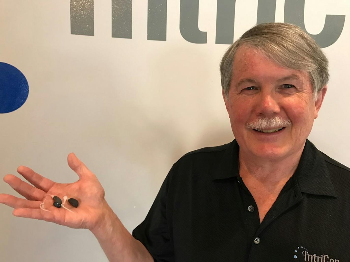 IntriCon CEO Mark Gorder with hearing aids in 2017.