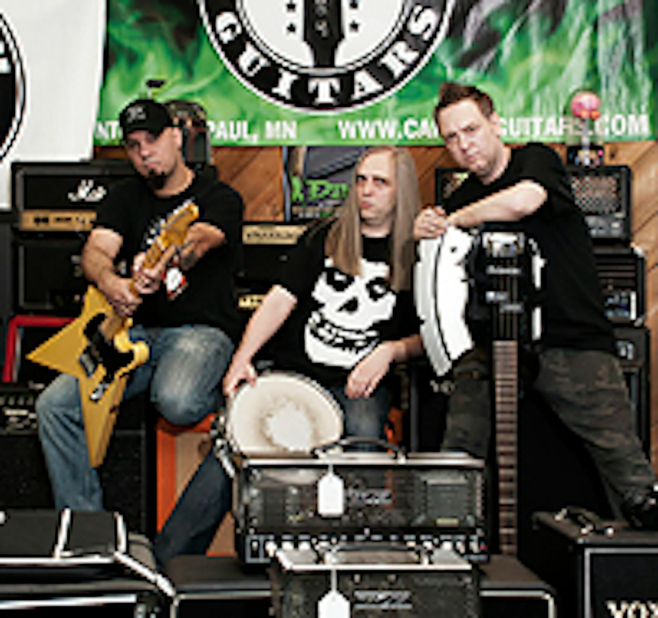 Capitol owners Eric Berg, left, and Billy Bergeron, right, with bandmate Tony Bergeron