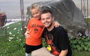 Aaron Luebke is shown with his son in a photo posted on a GoFundMe page for him.