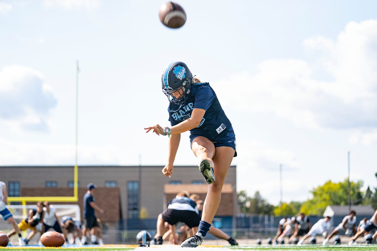 Kendall Stadden practiced her kickoffs with the Blaine High School football team on Thursday, September 9, 2021 only two hours before she started in a varsity girl's soccer match. ]