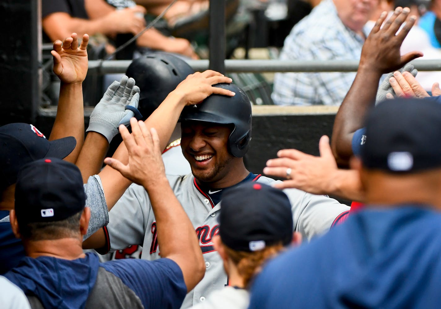 The Twins' Jonathan Schoop, center, got welcomed back to the dugout after his two-run home run in the fifth inning -- one of the team's four homers -- in a 11-1 rout of the Chicago White Sox on Sunday.