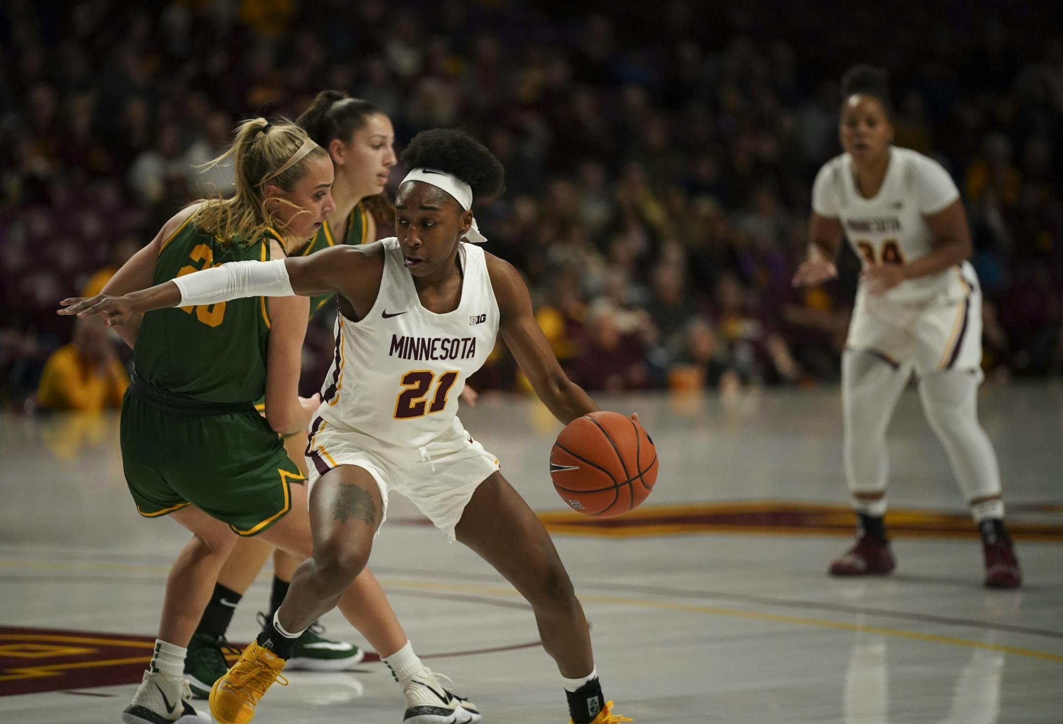Minnesota Golden Gophers guard Jasmine Brunson (21) made a move on Vermont Catamounts guard Emma Utterback (23) in the first quarter.