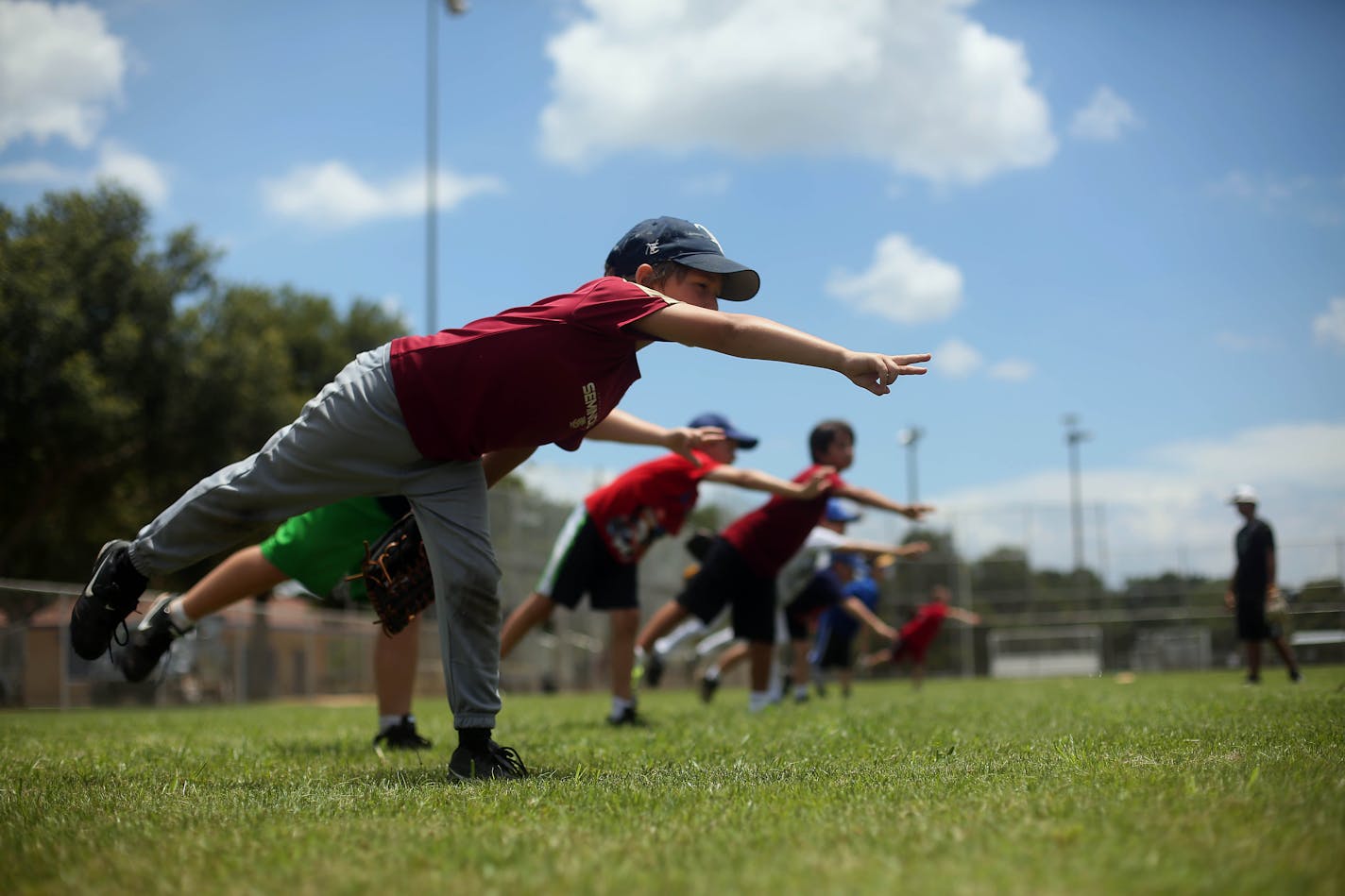 Jeremy Barton, 8, practices his pitching for 61 Sports Baseball Summer Camp at J.W. Cate Recreation Center on Wednesday, July 10, 2013. The camp, which is being taught by former Devil Rays pitcher Travis Phelps, ends this Friday. But another session will be held August 5th through August 7th. Phelps, who now coaches at St. Petersburg High School, says he teaches the fundamentals to kids ages 7-13 at the camp. "We still keep it fun," he added. The kids played on a Slip 'n Slide earlier in the day