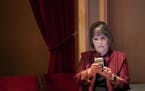 Rep. Betty McCollum checked her phone at the Fitzgerald Theater before the start of swearing in ceremonies for Governor Tim Walz and other constitutio