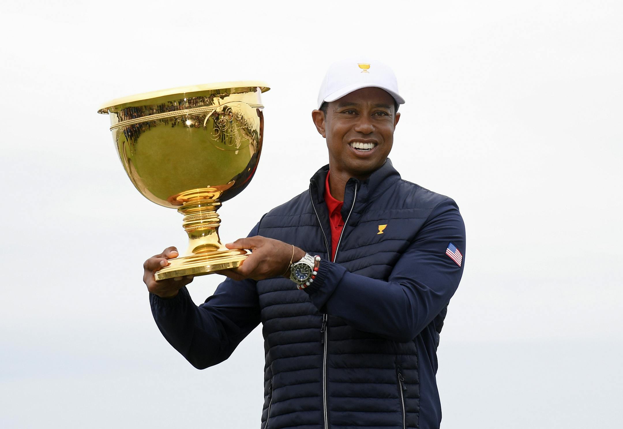 U.S. team player and captain Tiger Woods holds up the trophy after the U.S. team won the President's Cup golf tournament at Royal Melbourne Golf Club in Melbourne, Sunday, Dec. 15, 2019. The U.S. team won the tournament 16-14. (AP Photo/Andy Brownbill)