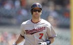 Minnesota Twins' Joe Mauer heads home after his solo home run during the first inning of a baseball game against the Detroit Tigers, Wednesday, July 2