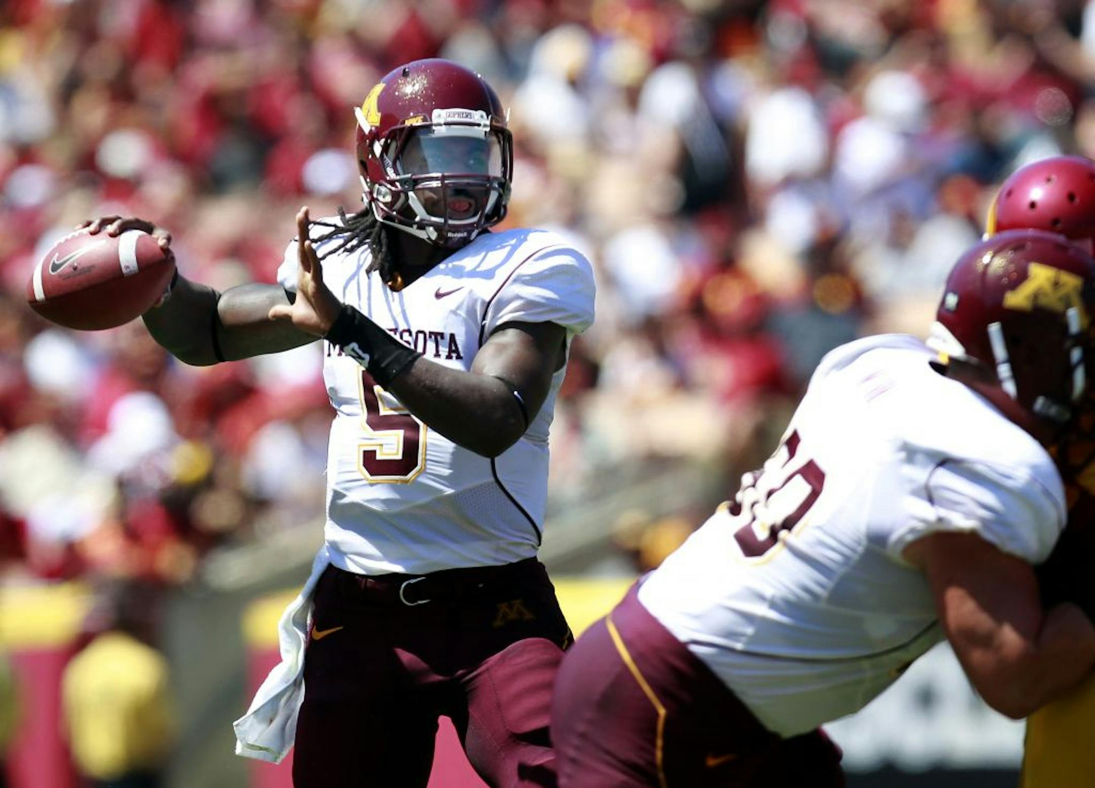 Minnesota quarterback MarQueis Gray (5) attempted a pass in the second quarter.
