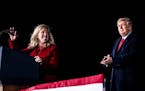 President Donald Trump applauded as Rep. Marjorie Taylor Greene, R-Ga., addressed a campaign event on behalf of Georgia’s Republican senators, Kelly
