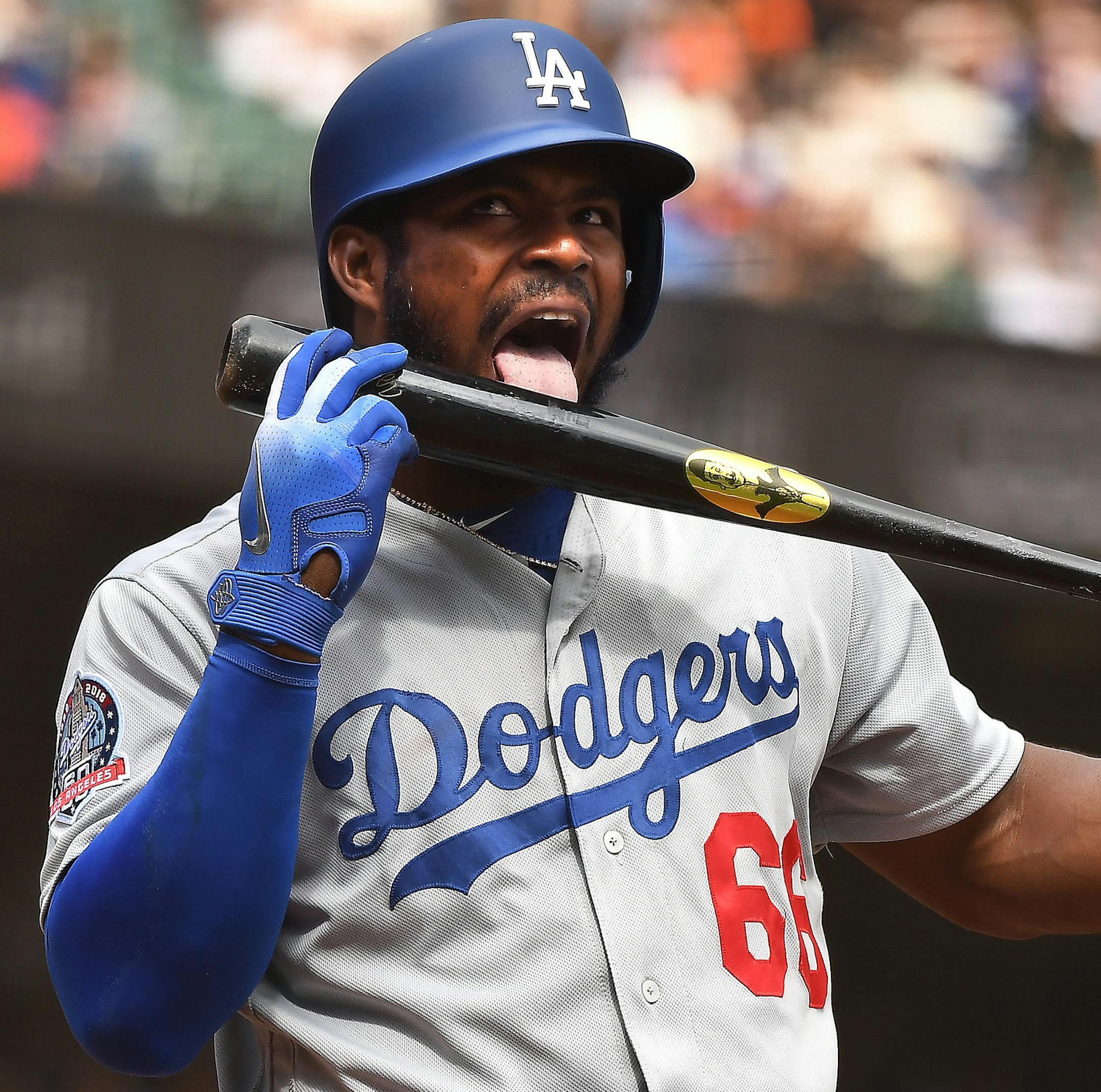 The Los Angeles Dodgers' Yasiel Puig licks his bat before hitting a solo home run on Sept. 29, 2018. Puig's home was one of the celebrities who was burgled with a spat of other high-profile burglaries in Los Angeles.(Wally Skalij/Los Angeles Times/TNS) ORG XMIT: 1241763