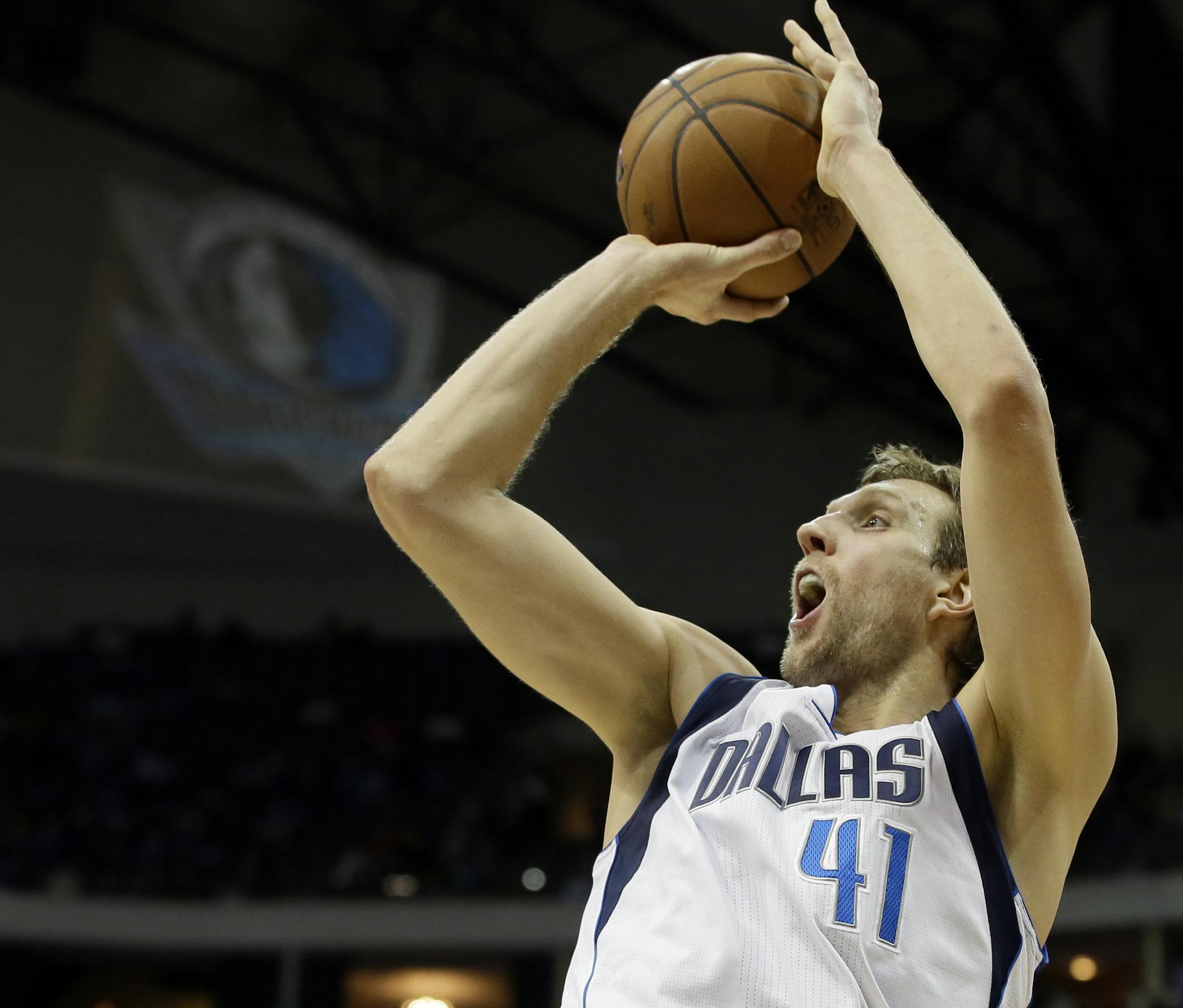 Dallas Mavericks power forward Dirk Nowitzki (41) of Germany falls back attempting a shot during an NBA basketball game against the Memphis Grizzlies, Wednesday, Dec. 18, 2013, in Dallas. The Mavericks won 105-91. (AP Photo/Tony Gutierrez) ORG XMIT: OTKTG207