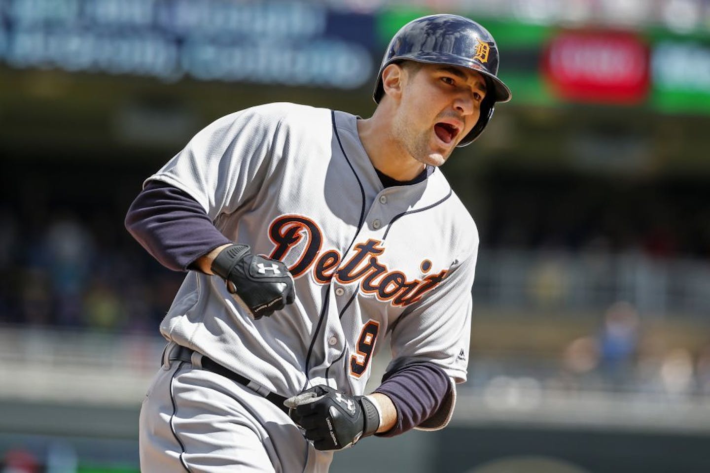 Detroit Tigers third baseman Nick Castellanos celebrates his 3-run home run to tie the game against the Minnesota Twins as he runs the bases in the sixth inning of a baseball game, Sunday, May 1, 2016, in Minneapolis.