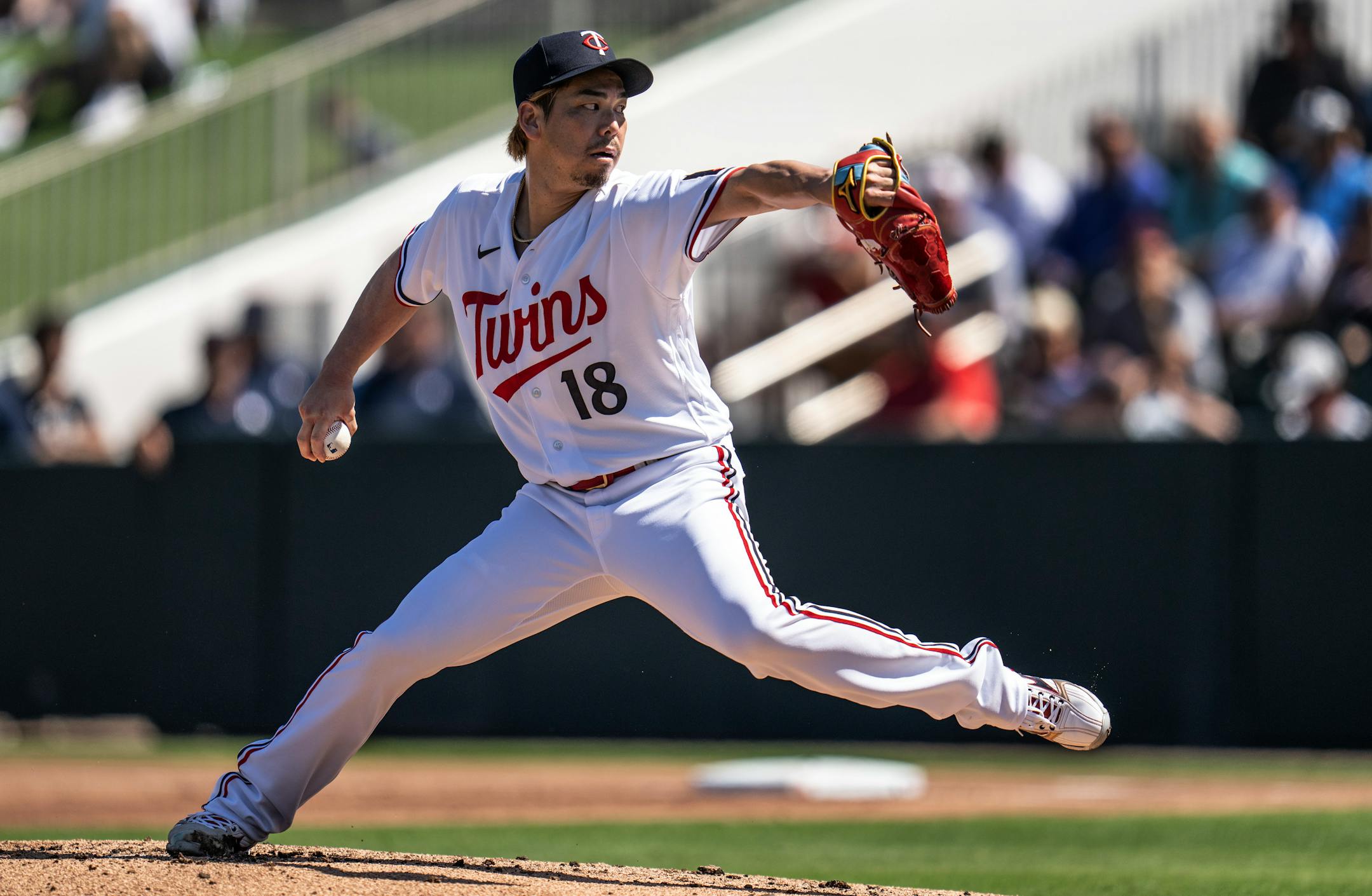 Minnesota Twins starting pitcher Kenta Maeda (18) threw his first pitch of the 2023 spring season.