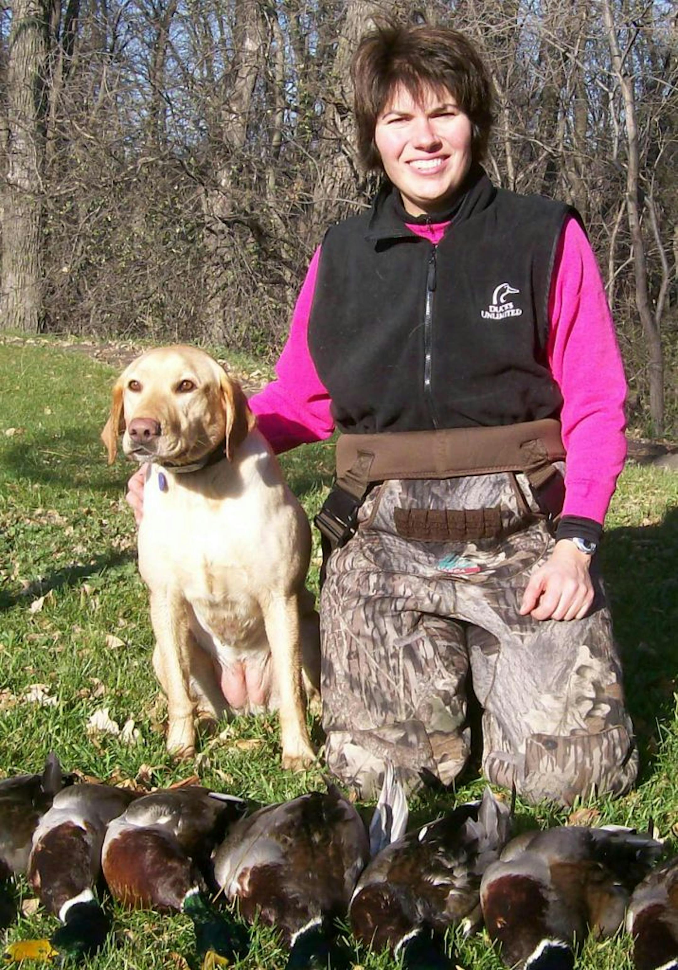 Jane Heinks of New Brighton with her Lab, Tandy, and after a mallard hunt. Tandy contracted blastomycosis, a rare but serious fungal disease, and died from it. Photo courtsey Jane Heinks.