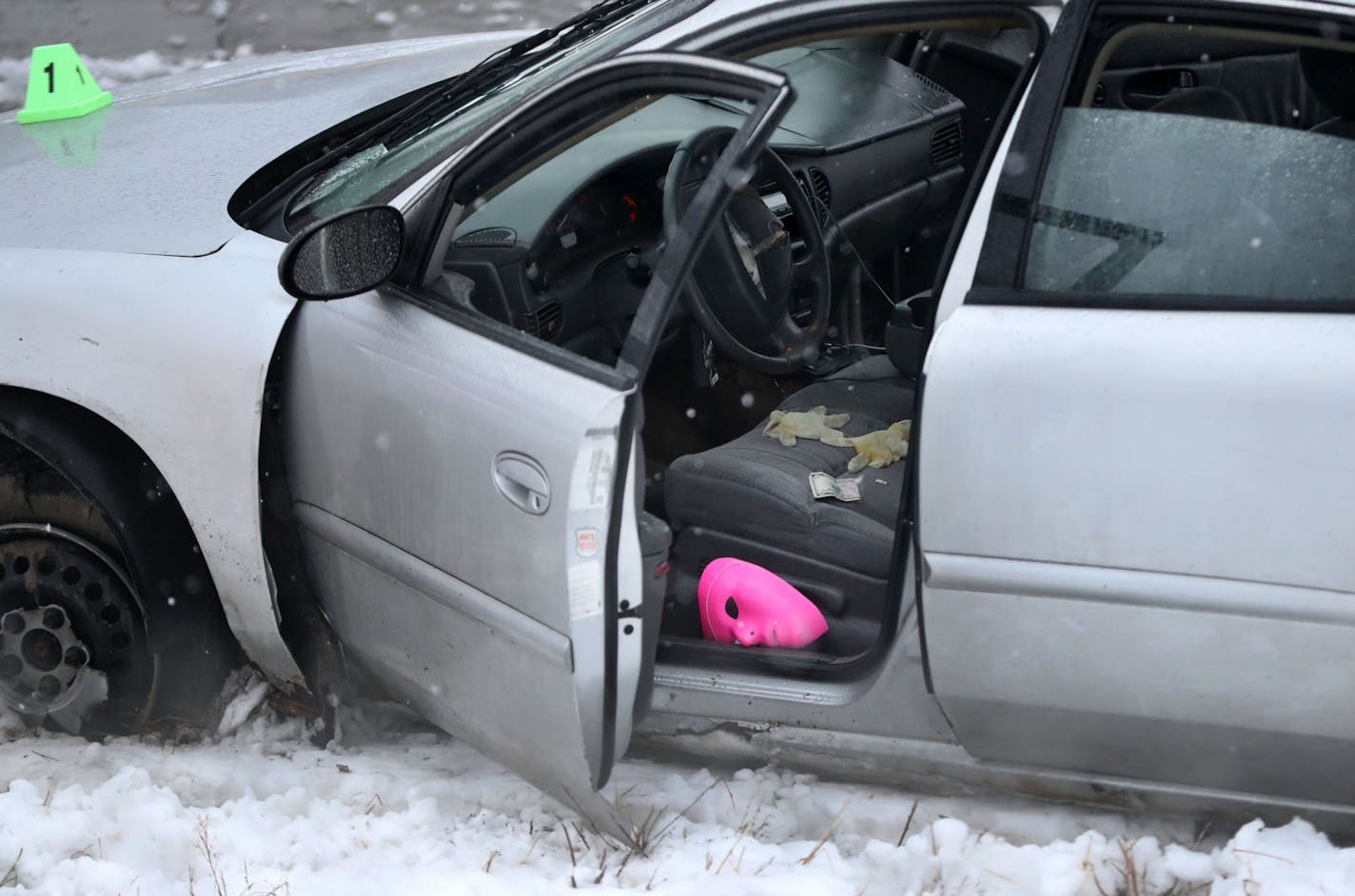 A car sits at the scene where an officer-involved shooting occurred early Wednesday at Bren Road and Highway 169 in Edina.